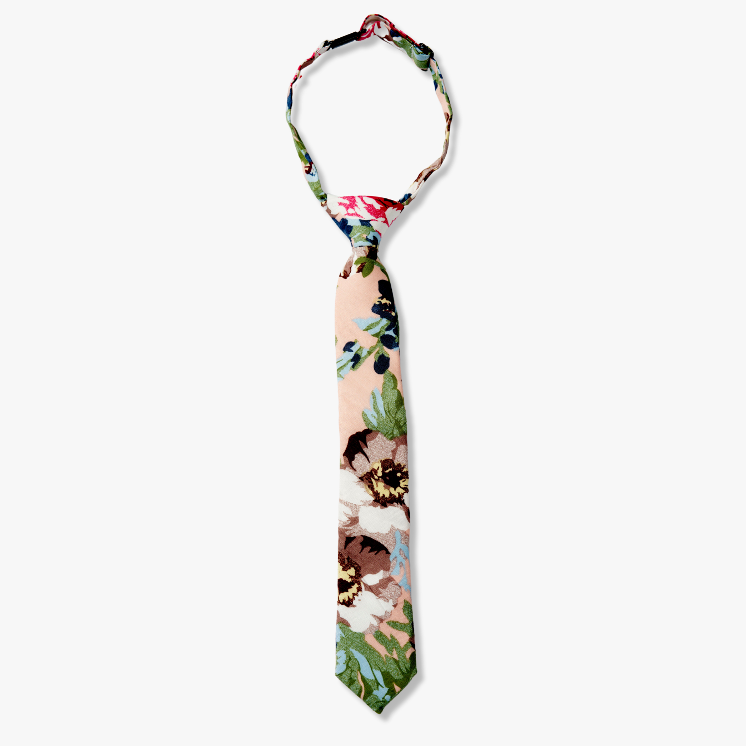 Kids floral pretied tie with dark blue flowers, brown petals, and light green watercolor leaves on light pink cotton fabric.
