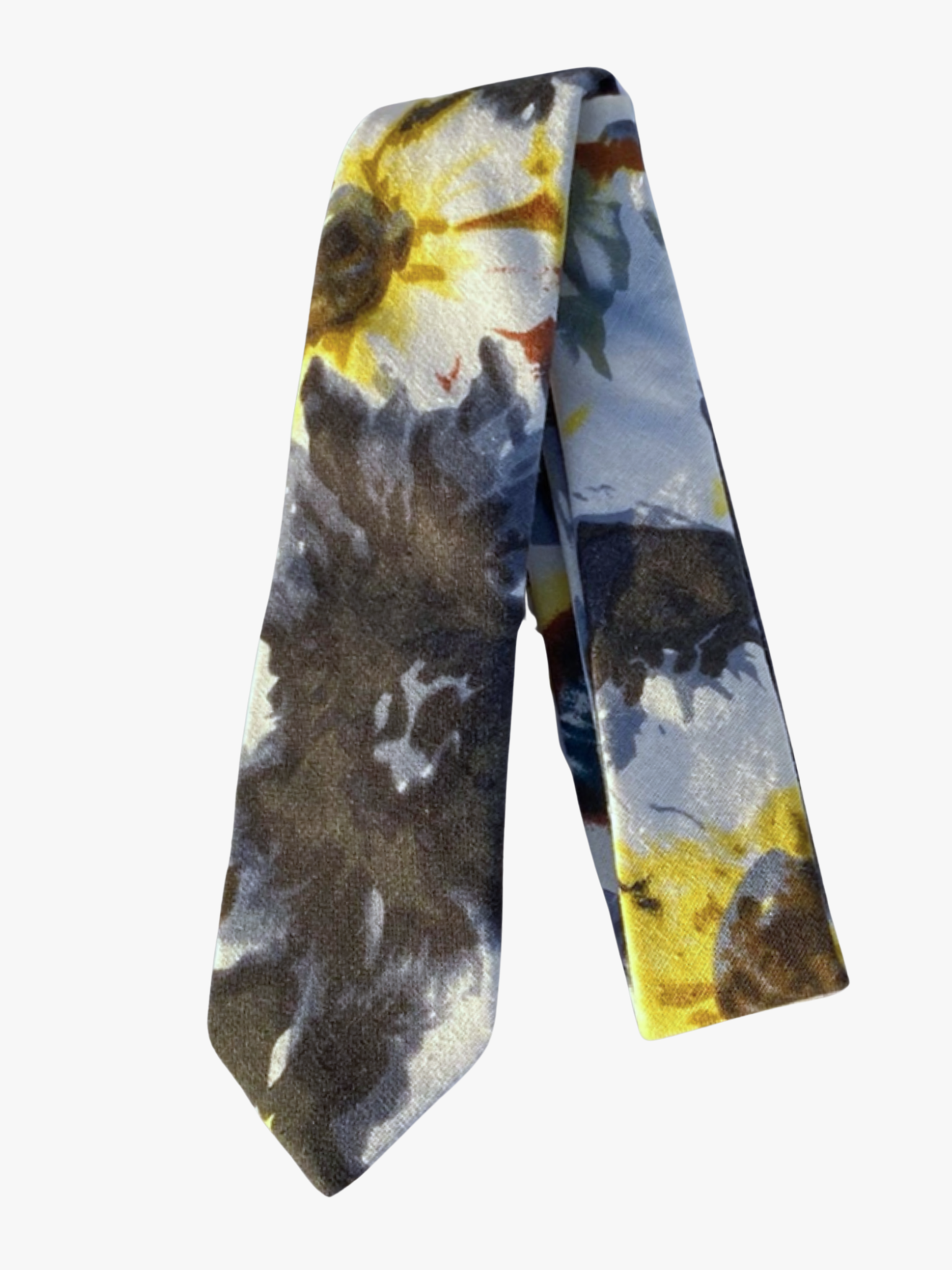 A folded floral adult men's necktie with large abstract yellow flowers mixed with large splotches of black and blue.