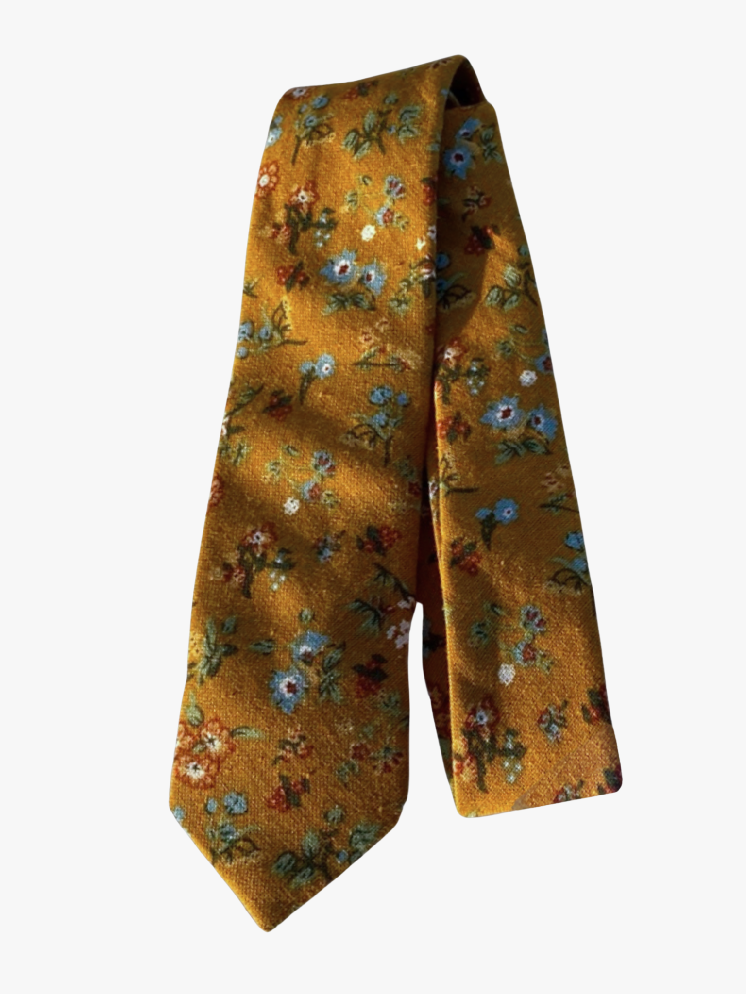 A folded floral adult men's necktie with dark yellow fabric, pale blue flowers, light green leaves, and red and white detail.