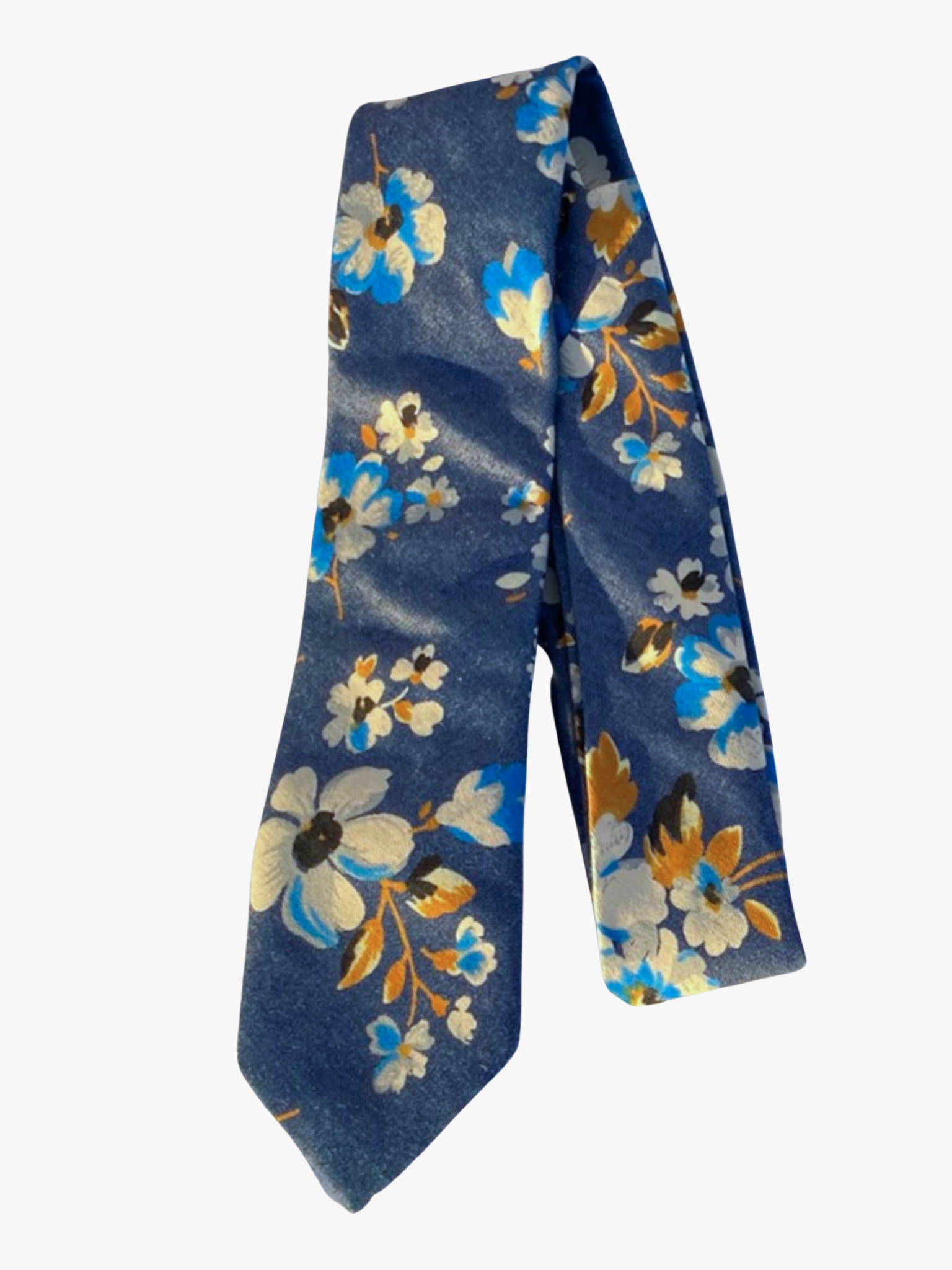 A folded floral adult men's necktie with blue denim fabric, painted white flowers with bronze stems, and bold blue accents.