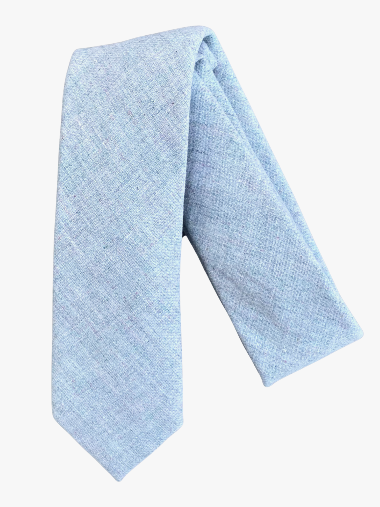 A folded solid speckled adult men's necktie with plain light stone gray fabric.