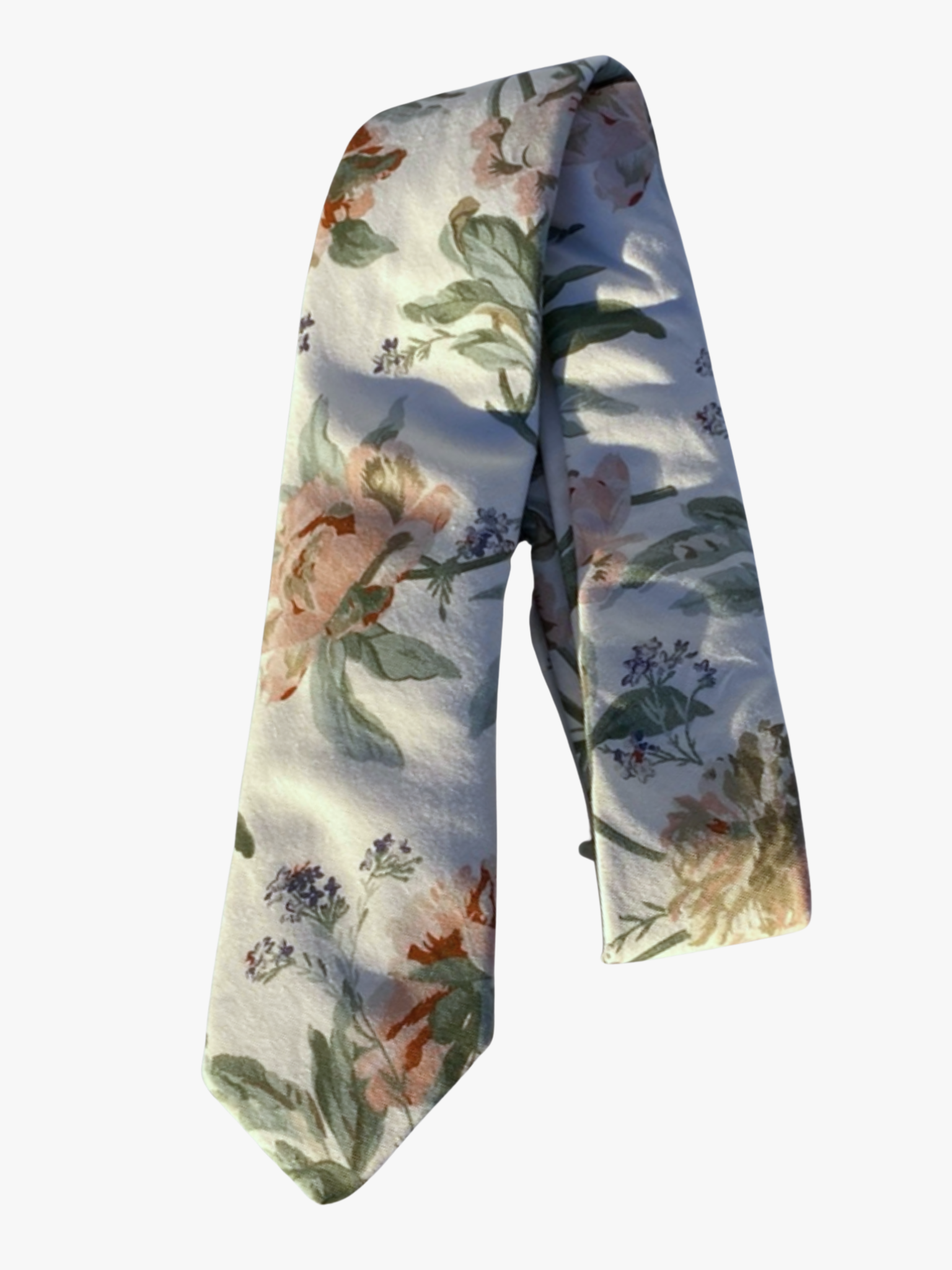 A folded floral adult men's necktie with offwhite fabric, floral designs of pale pink flowers, and pastel light green leaves.