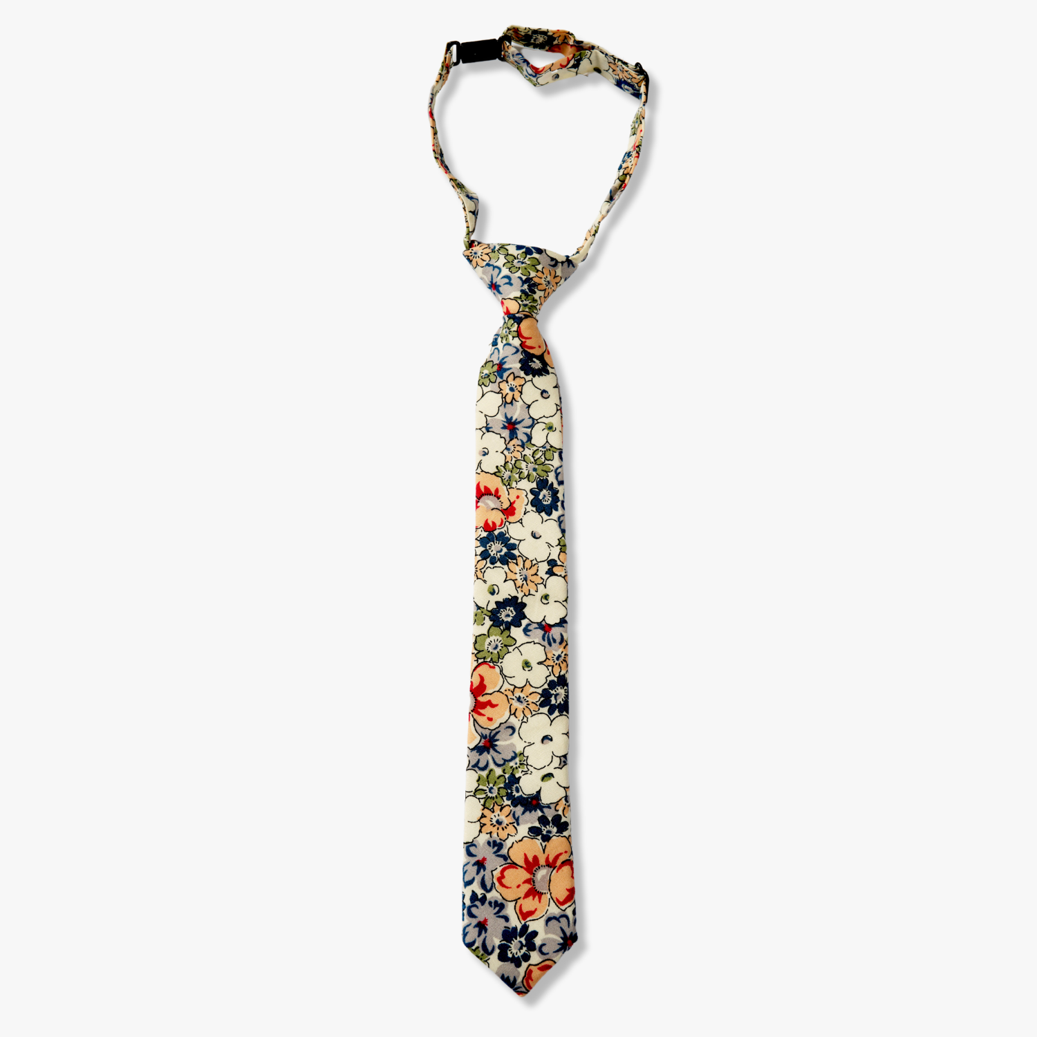 Kids floral pretied tie with blue flowers, white petals, and peach or salmon blossoms and green leaves on white cotton fabric