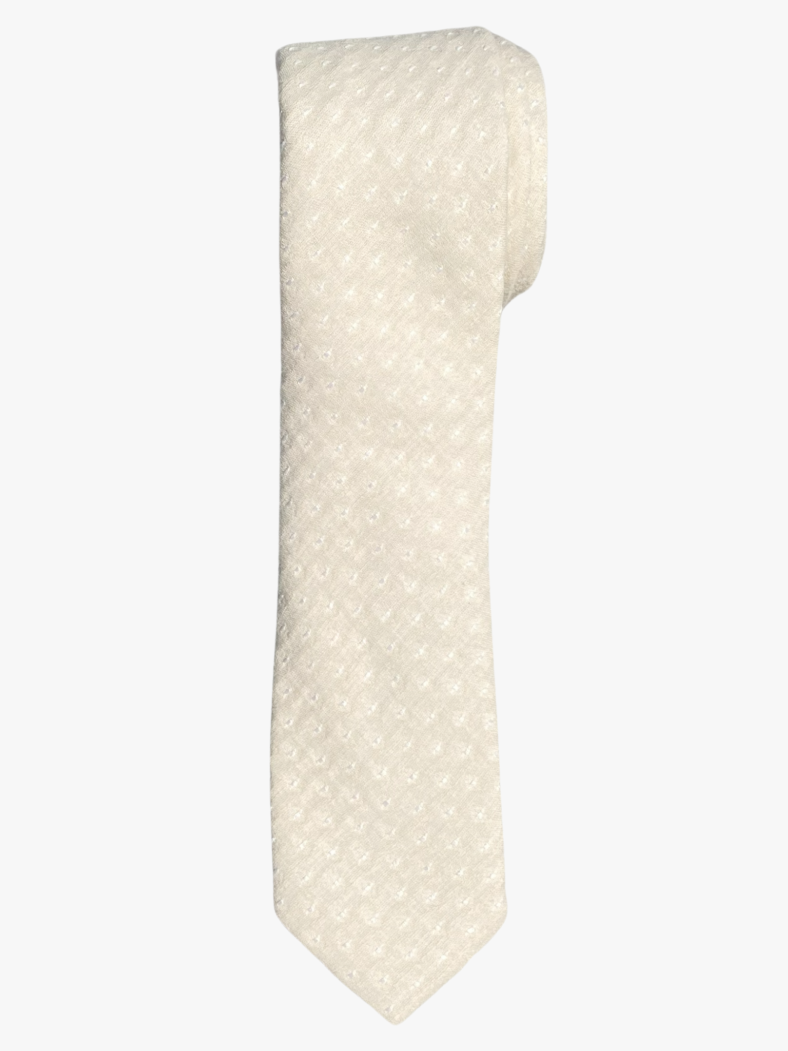A rolled up unisex khaki tan and white polka dot cotton necktie for teens, missionaries, men, and women.
