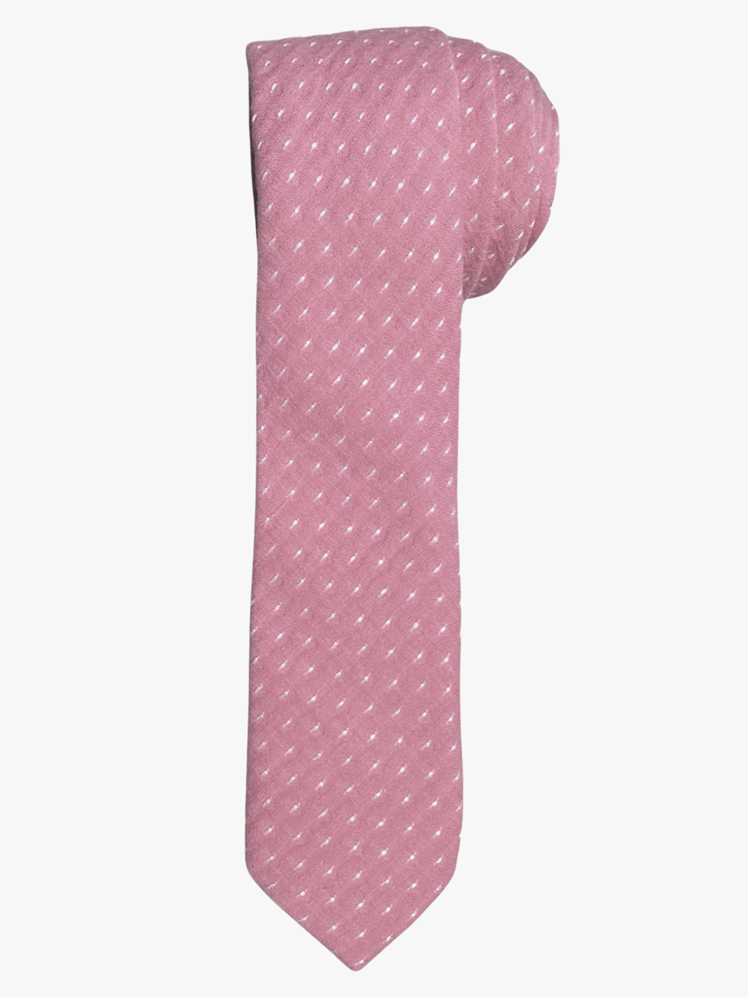 A rolled up unisex dark fuchsia pink and white polka dot cotton necktie for teens, missionaries, men, and women.