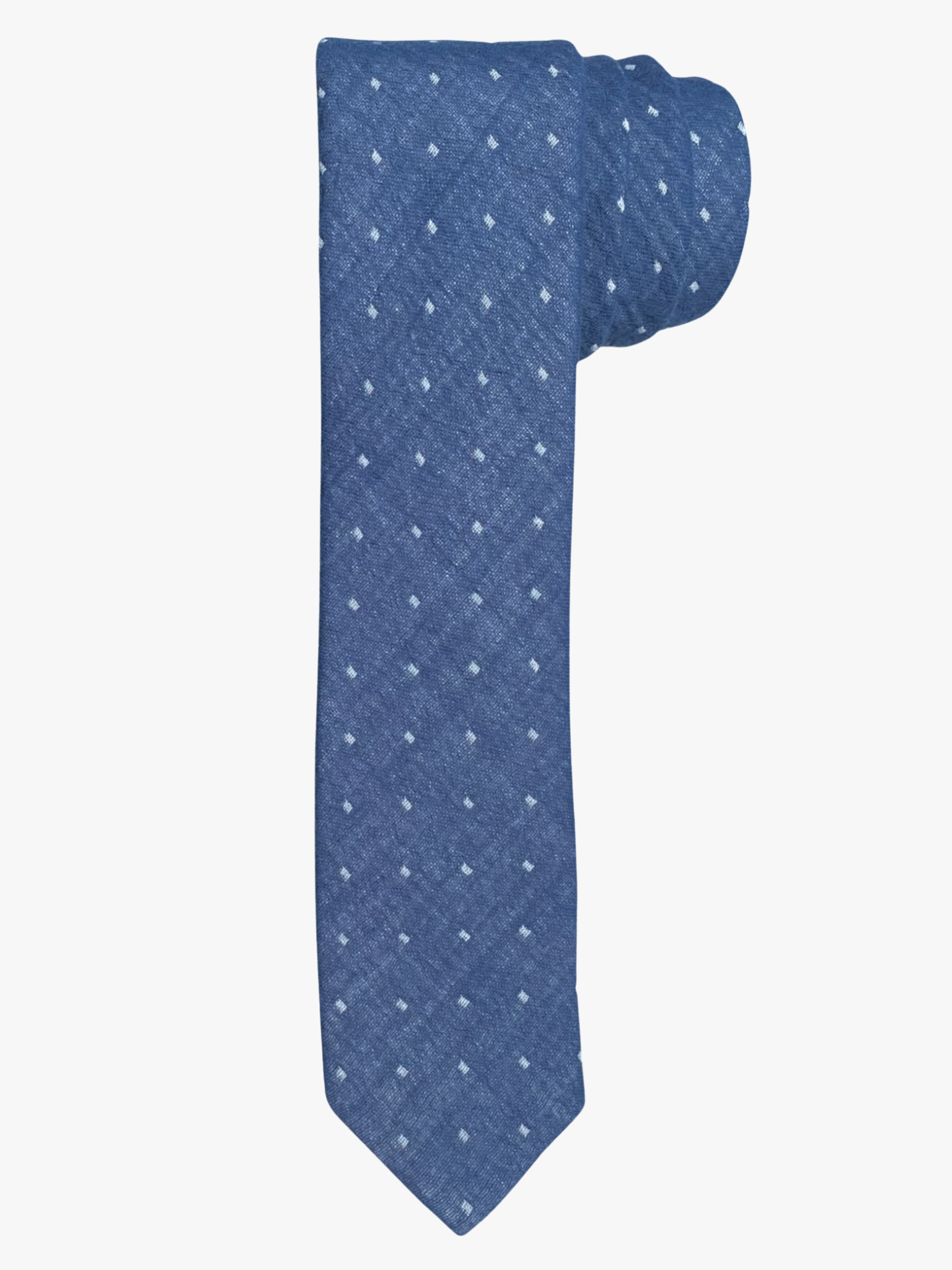 A rolled up unisex navy blue and white polka dot cotton necktie for teens, missionaries, men, and women.