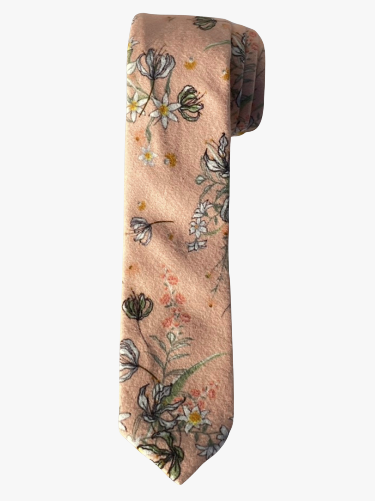A rolled up salmon, yellow, white, pink, black, and green floral cotton necktie for teens, missionaries, men, and women.