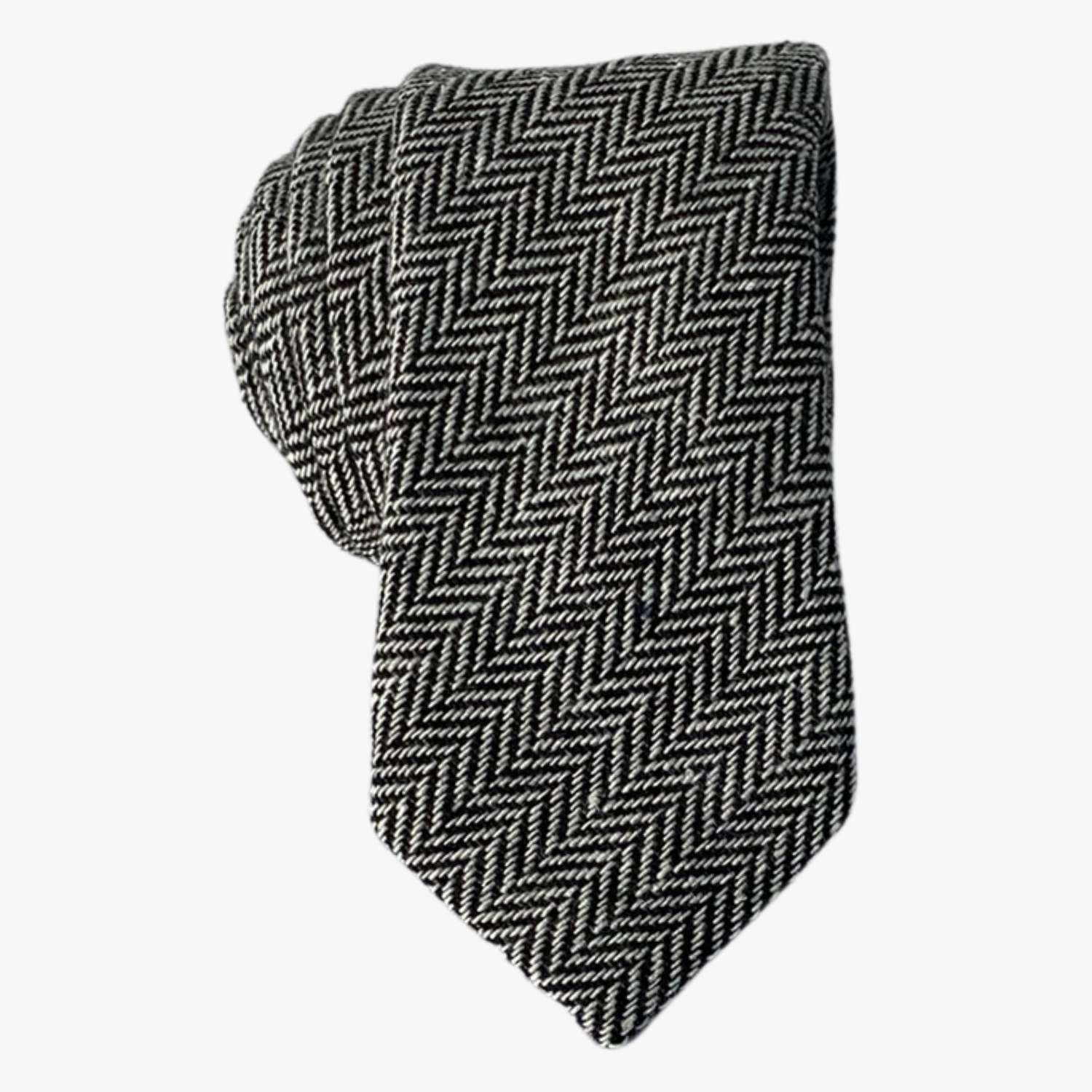 Adult mens herringbone tie with black and white arrow designs and an infinite repeating diagonal pattern for missionaries.