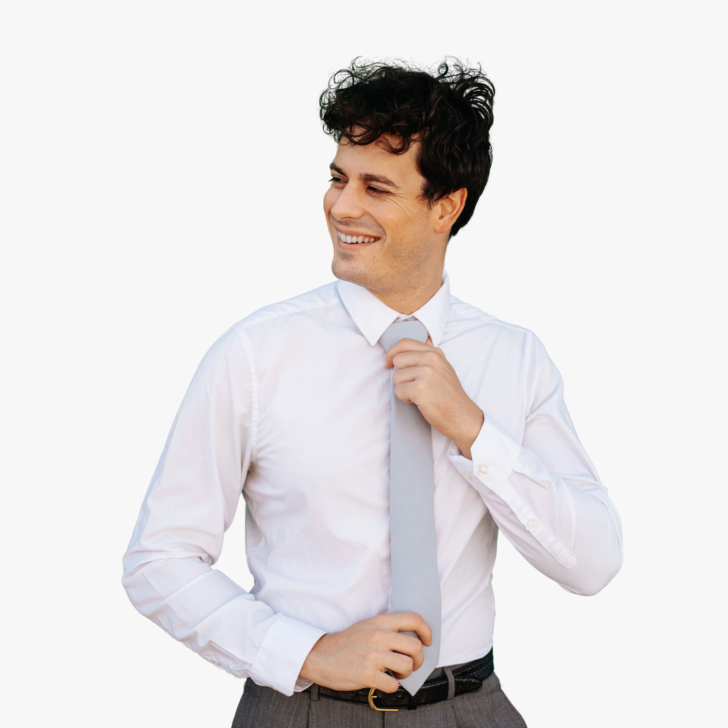 A man with a solid tie with a plain pale solid blue/gray color.