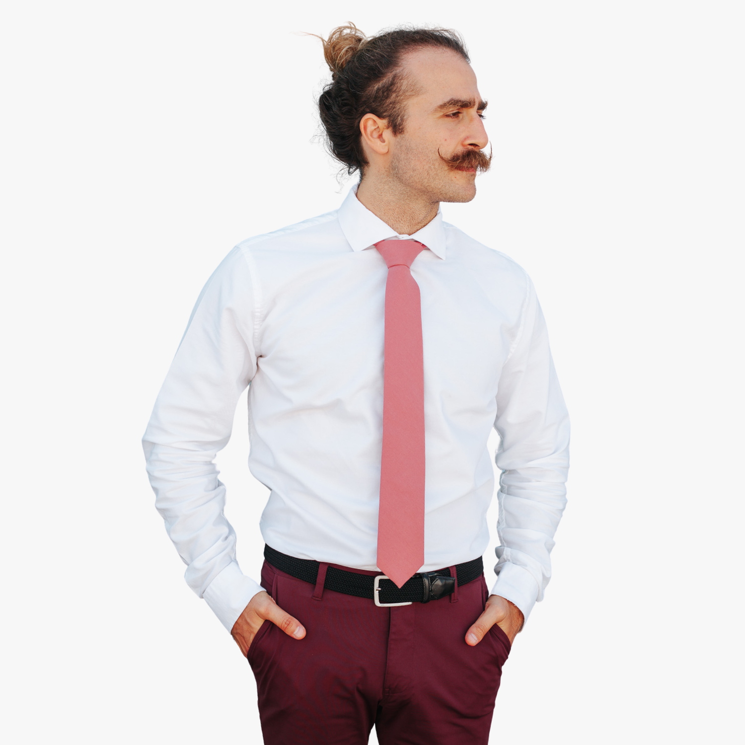 A man with a solid tie with a plain darker rose-gold dusty pink color.
