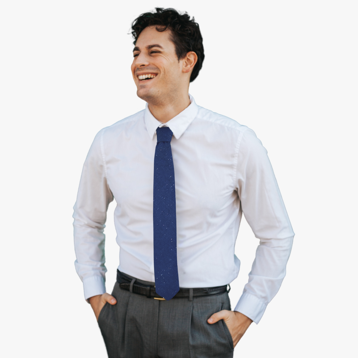 A man wearing a solid speckled tie with multi color spots and dots on navy fabric.