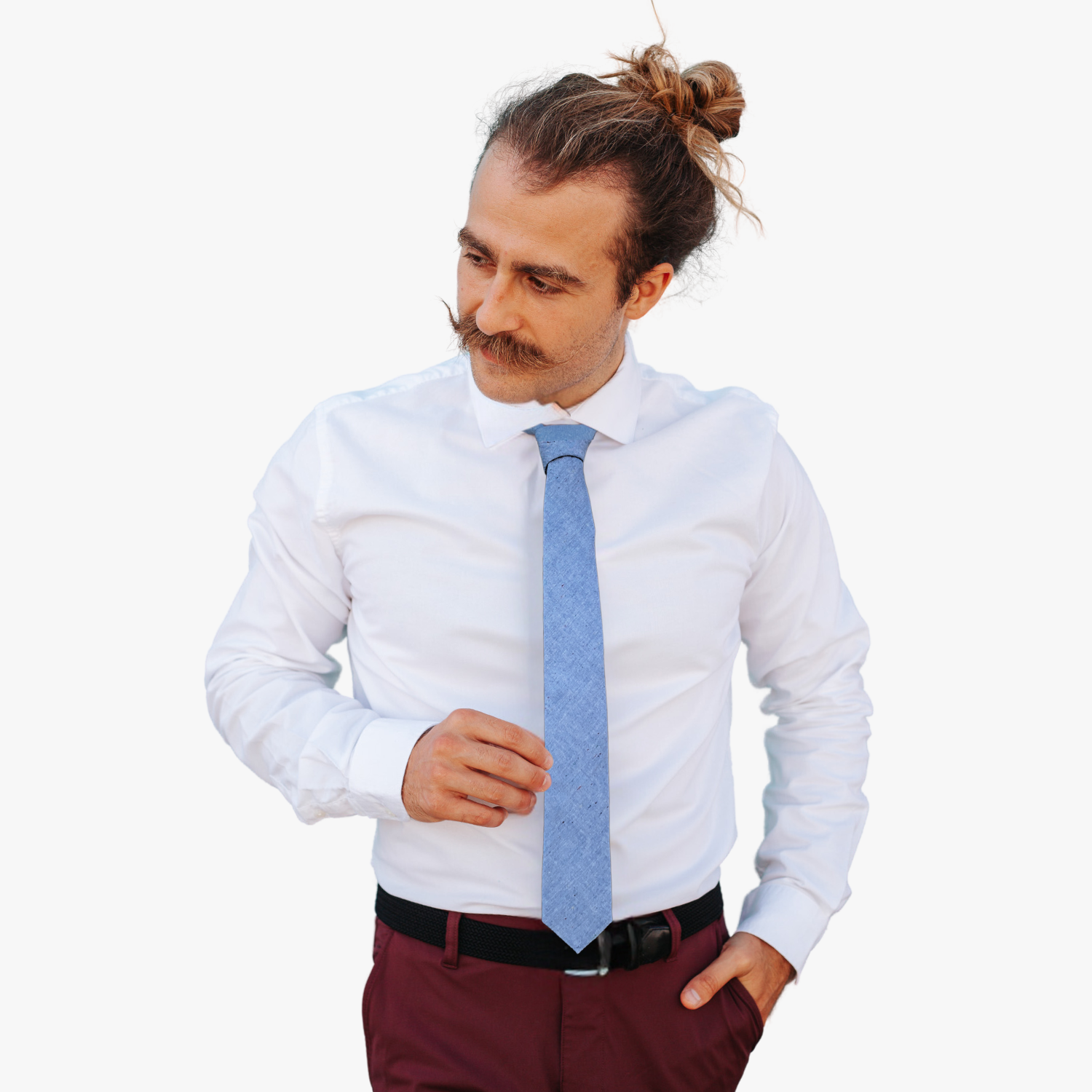 A man wearing a solid speckled tie with pale baby blue fabric and spots, dots, or speckles of color.