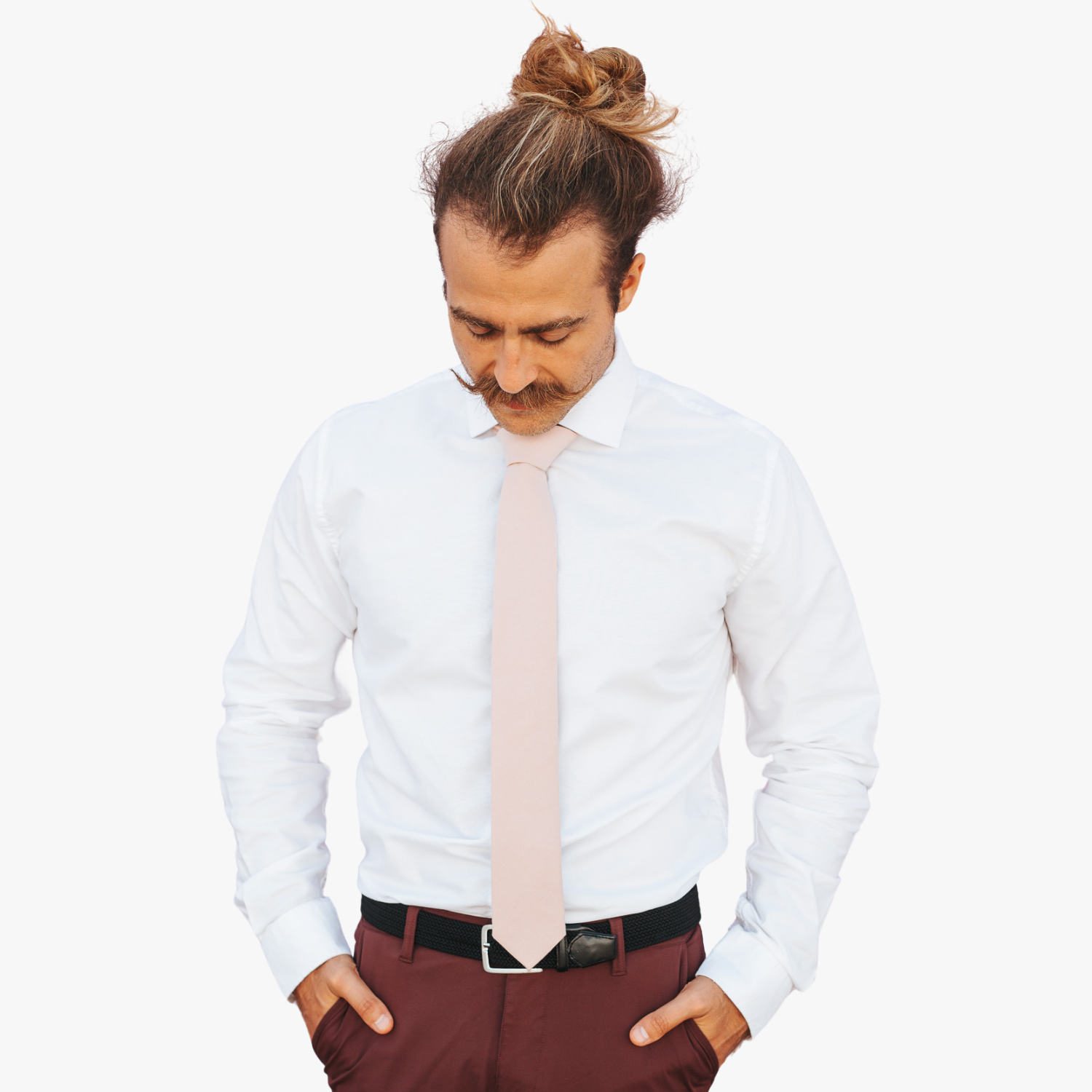 A man with a solid tie with a plain neutral pink taupe color.