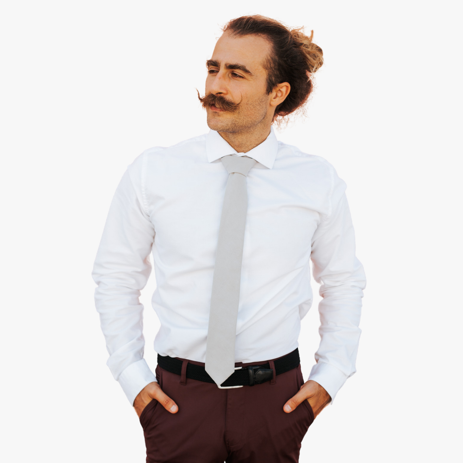 A man with a solid tie with a plain netural very light brown or sandy tan/gray color.