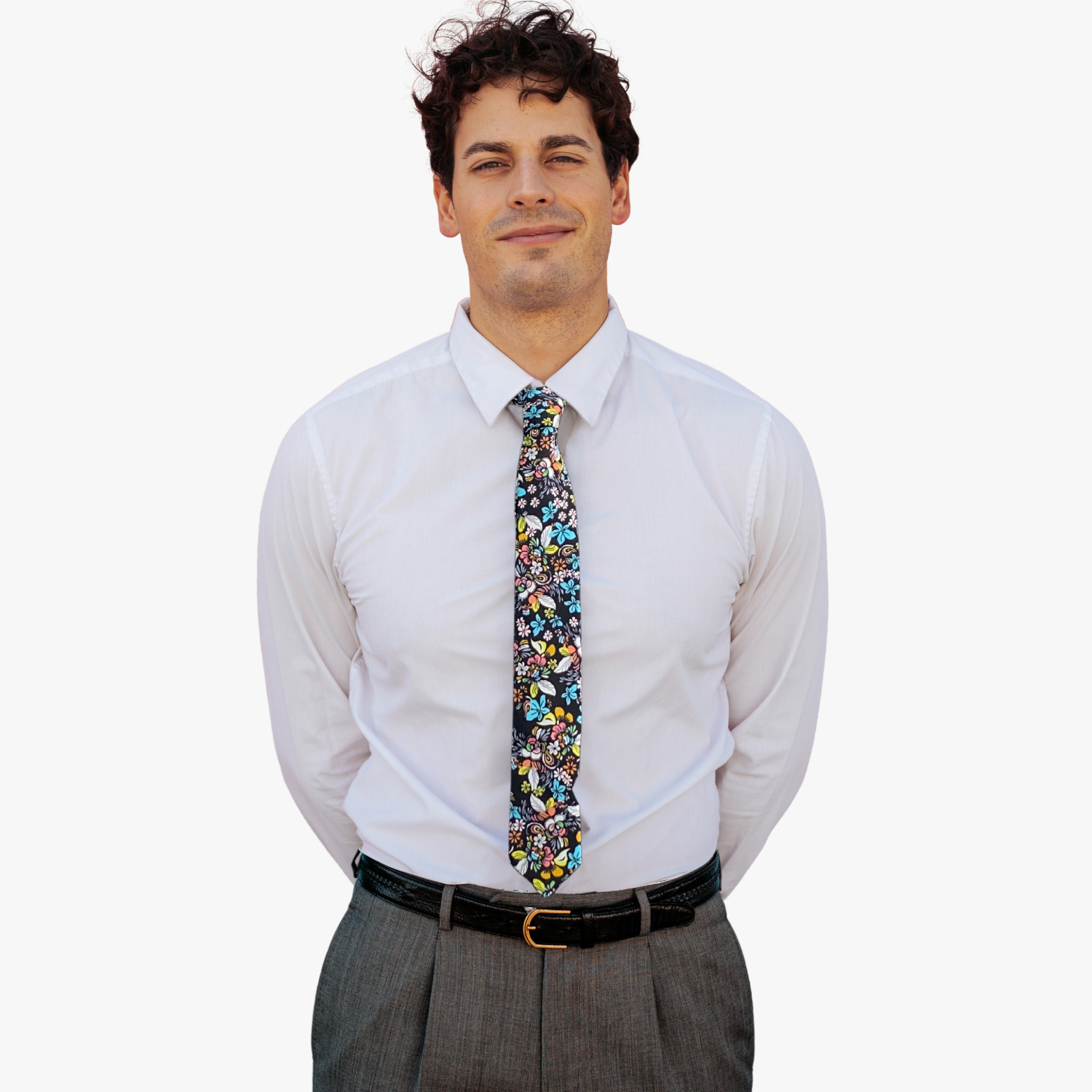 A man wearing a floral tie with black fabric, colorful blue and yellow flowers and green, orange, and pink nature designs.