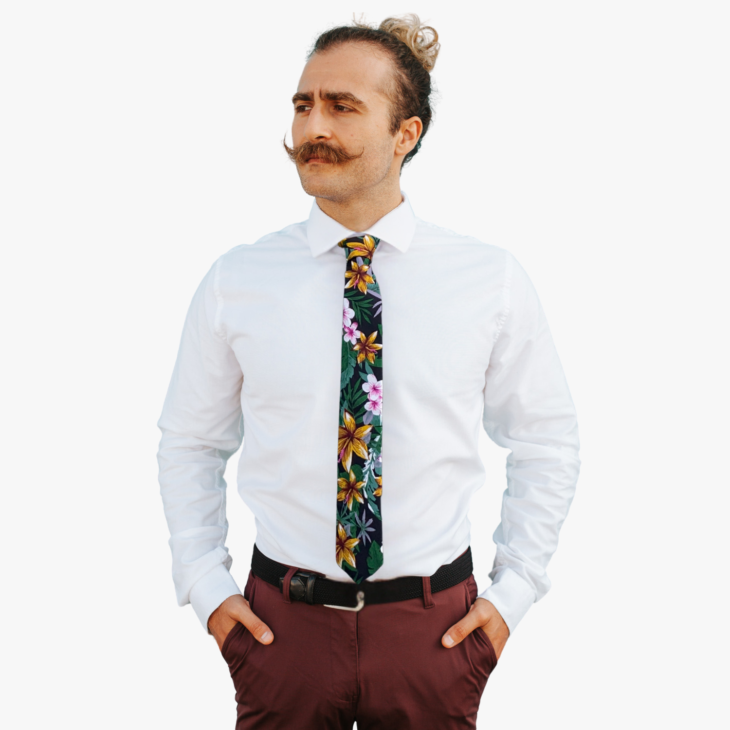 A man wearing a floral tie with black fabric, tropical golden yellow flowers, green jungle leaves, and pastel green accents.