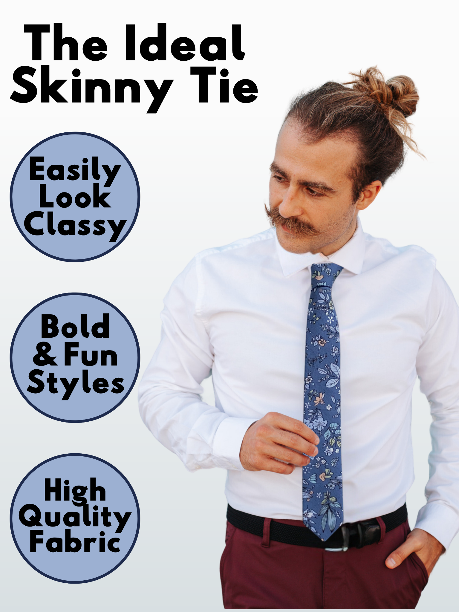 A man in a deep blue, pale blue, light green, and pink floral modern slim necktie that is 2.5 inches wide and made of cotton.
