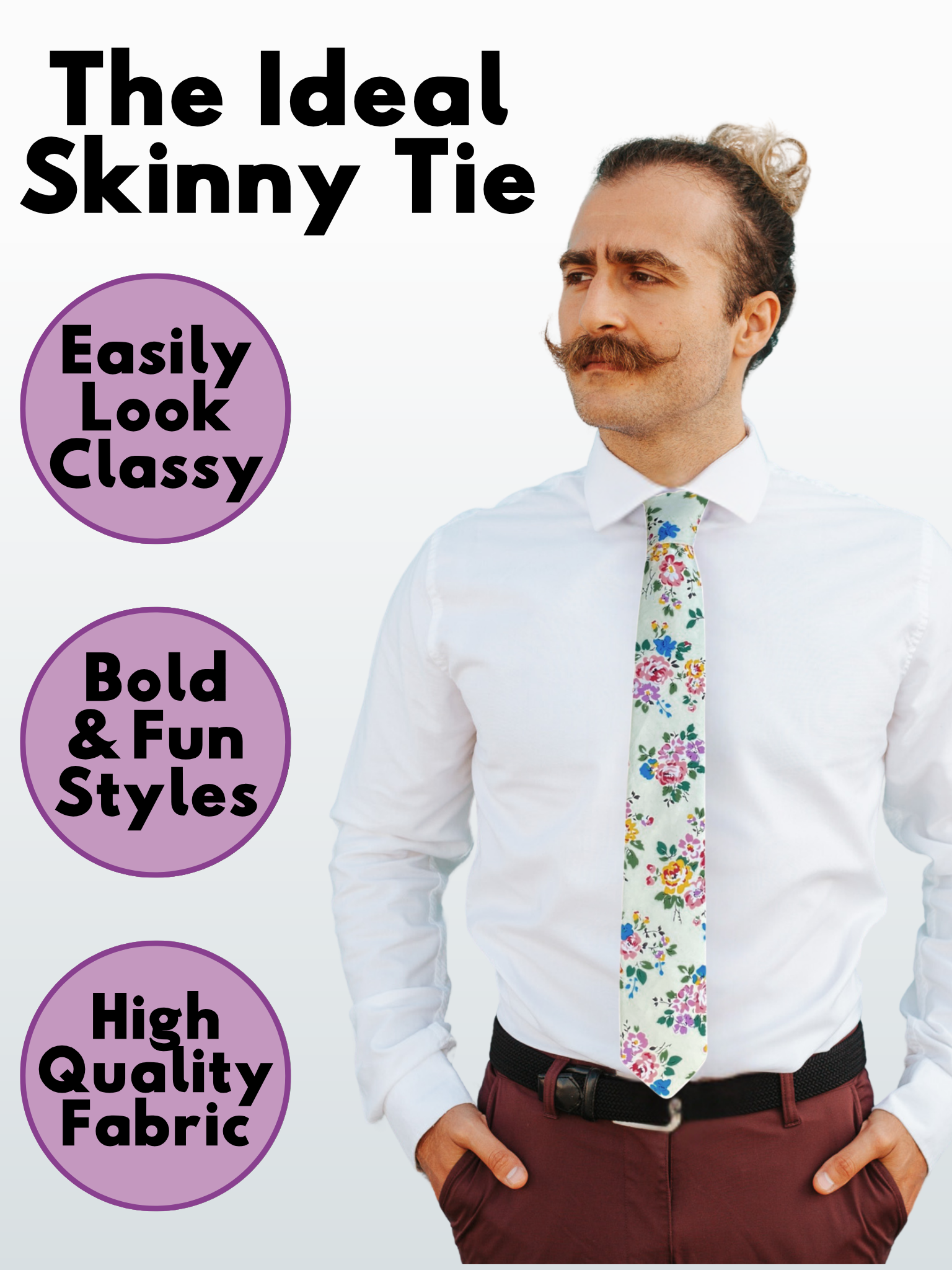 A man in a dark green, blue, yellow, and lavender floral modern slim necktie that is 2.5 inches wide and made of cotton.