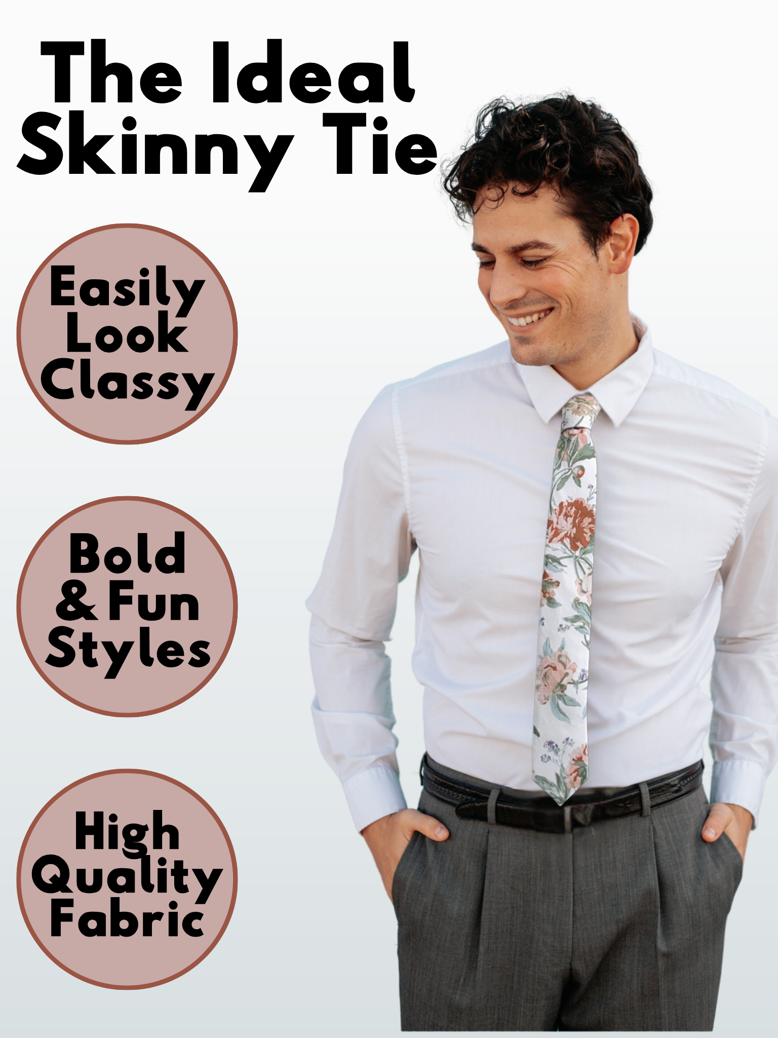 A man in a offwhite, pale pink, and pastel light green floral modern slim necktie that is 2.5 inches wide and made of cotton.