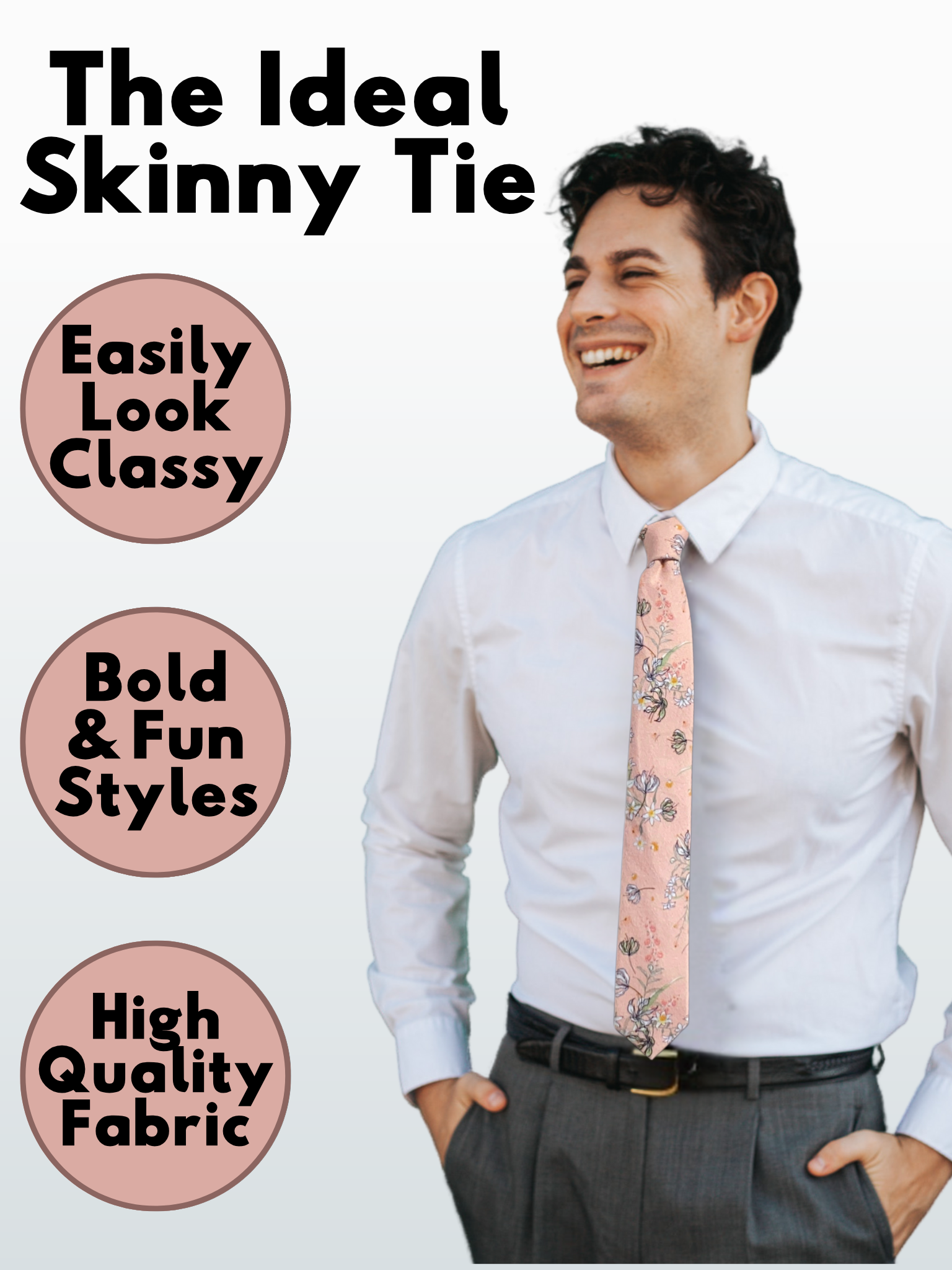 A man in a salmon, yellow, white, pink, black, and green floral modern slim tie that is 2.5 inches wide and made of cotton.