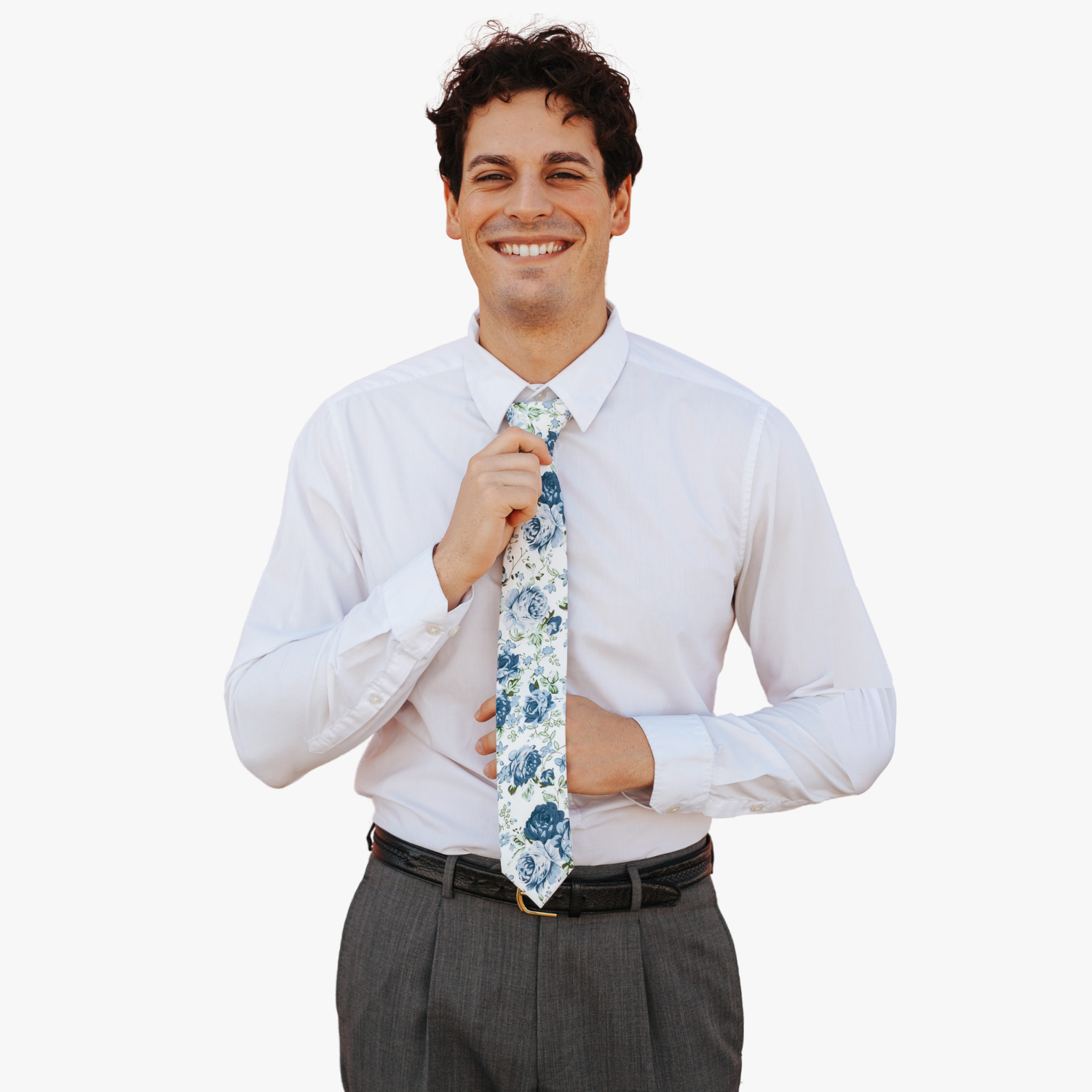 A man wearing a floral tie with  large blue flowers, dusty petals, and light green leaves.