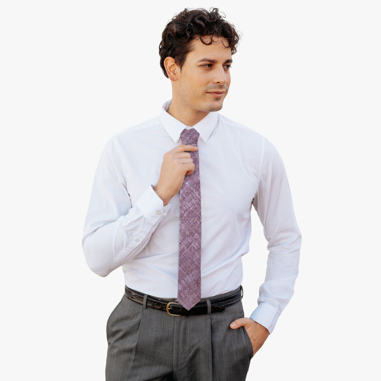A man wearing a solid speckled tie with light himalayan salt pink with occasional streaks of dark pink.