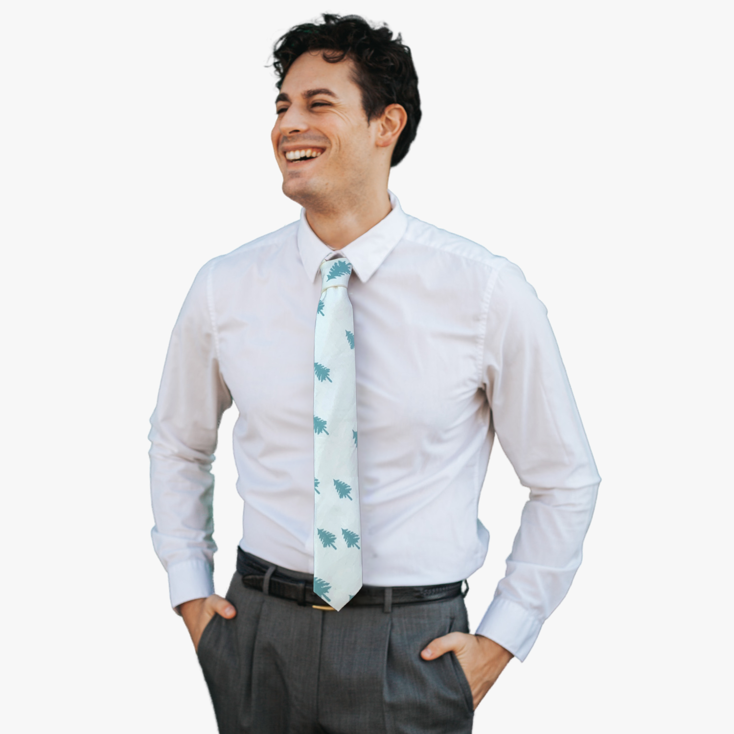 A man wearing a Christmas tree tie with pale jade green pine trees silhouette on a snowy white fabric.