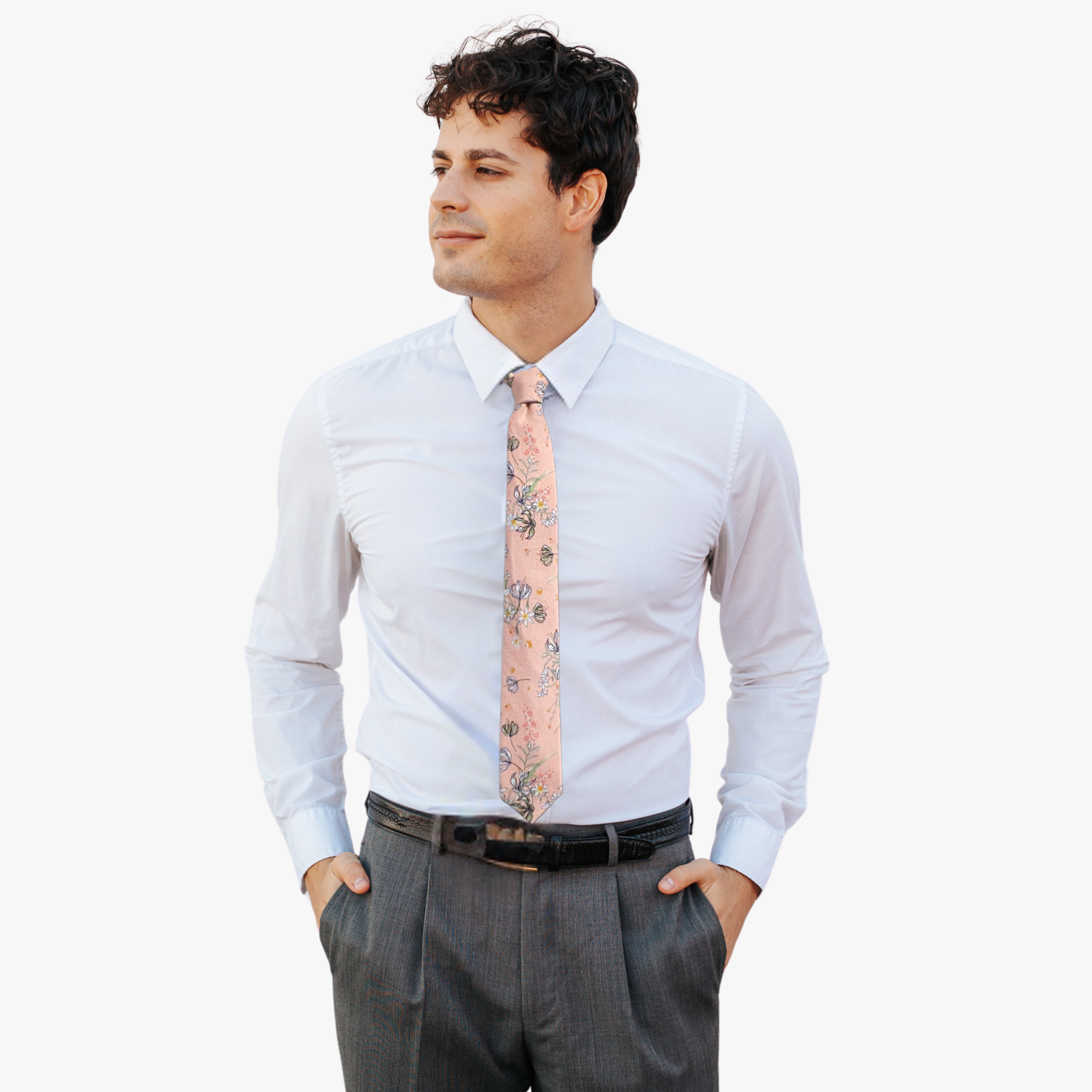 A man wearing a floral tie with peach fabric, white and yellow flowers outlined in black, pink flowers, and green leaves.