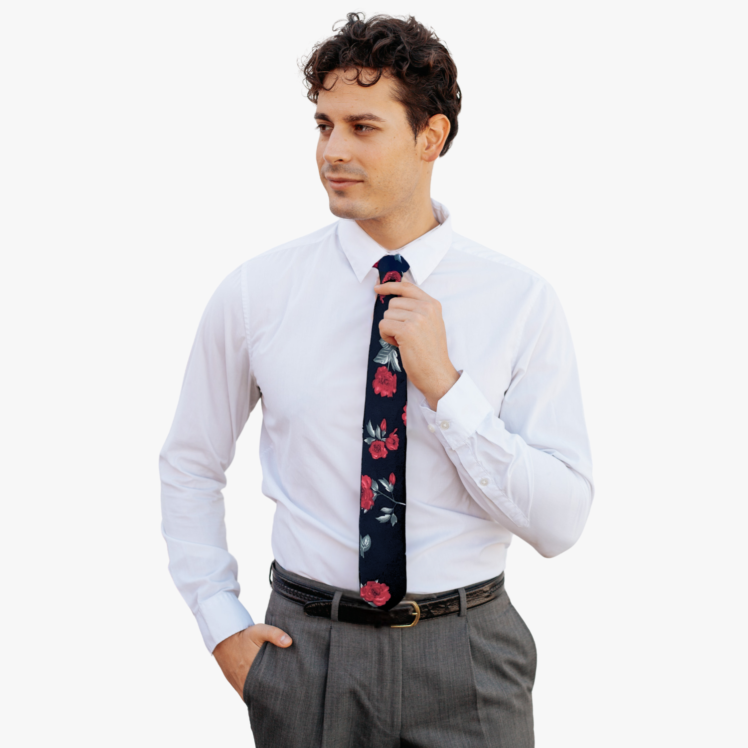 A man wearing a Christmas floral tie with red poinsettia flowers, pastel green leaves, and black fabric.