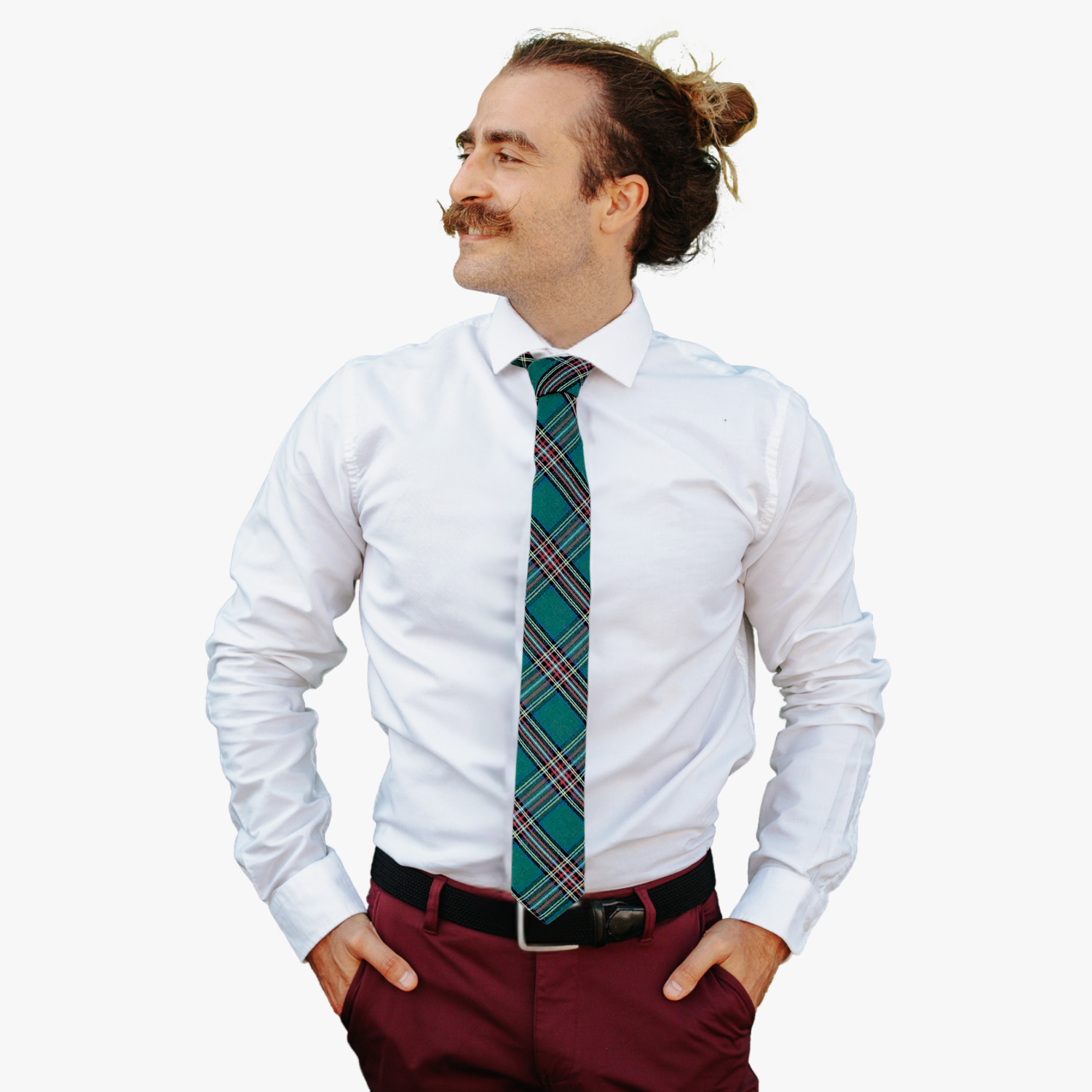 A man wearing a plaid tie with tartan designs of red, white, blue, and yellow, on dark green fabric.
