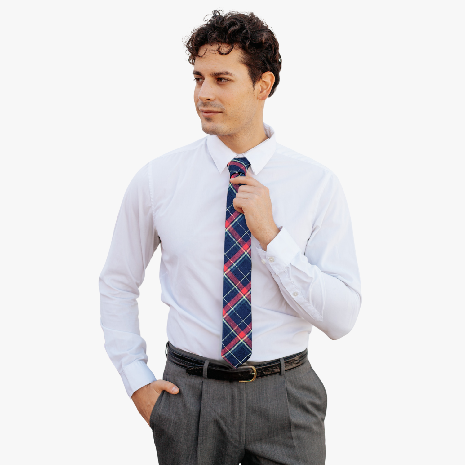 A man wearing a plaid tie with tartan designs of red, yellow, and subtle green on navy blue fabric.