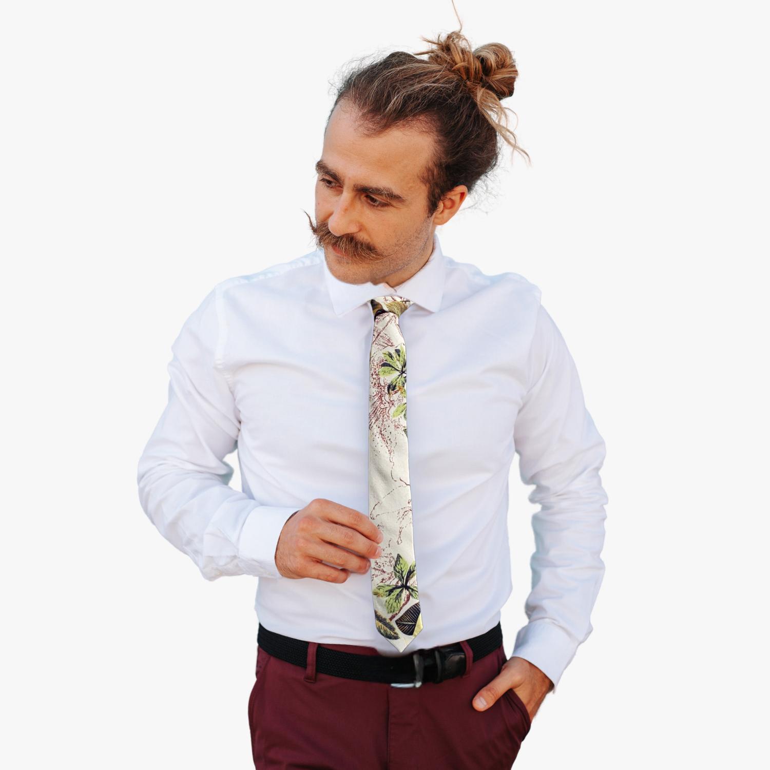 A man wearing a floral tie with retro woven beige fabric, yellow and green leaves accented with artistic brown patterns.