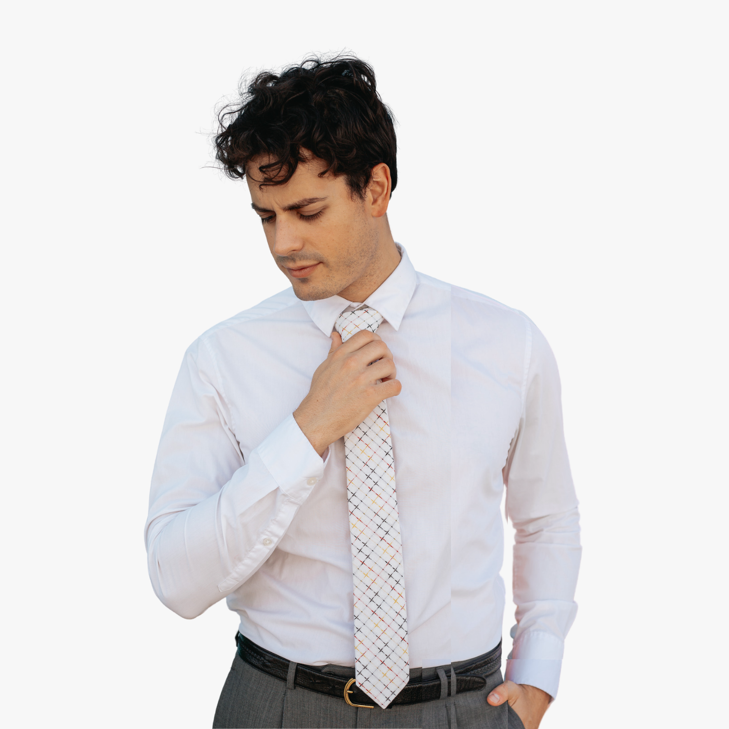 A man wearing church clothes and a striped tie with colorful grid designs, intersecting red, yellow, and black lines.