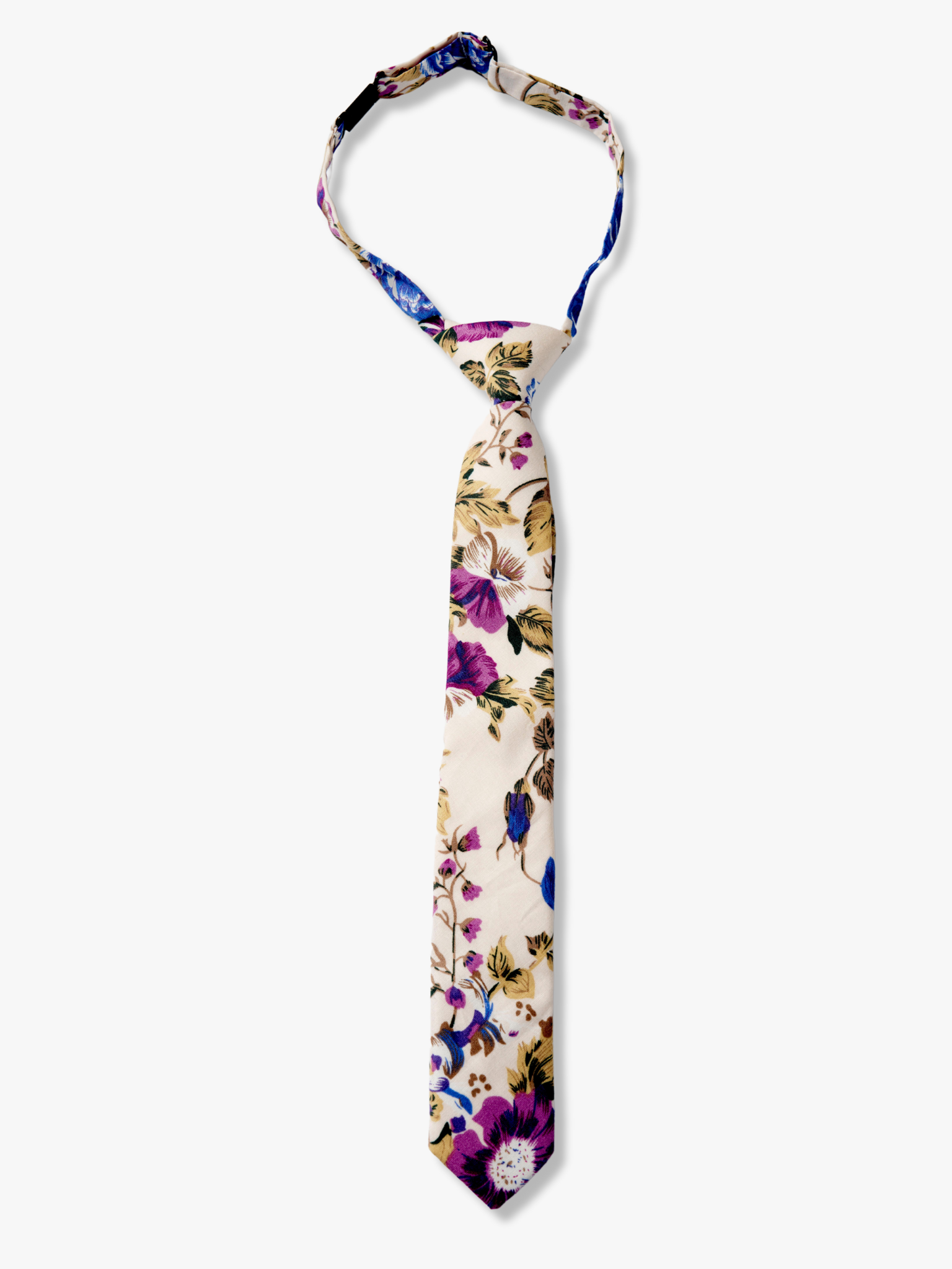 Kids floral pretied tie with purple flowers, blue petals, brown accents and fall leaves on a cream or beige cotton fabric.