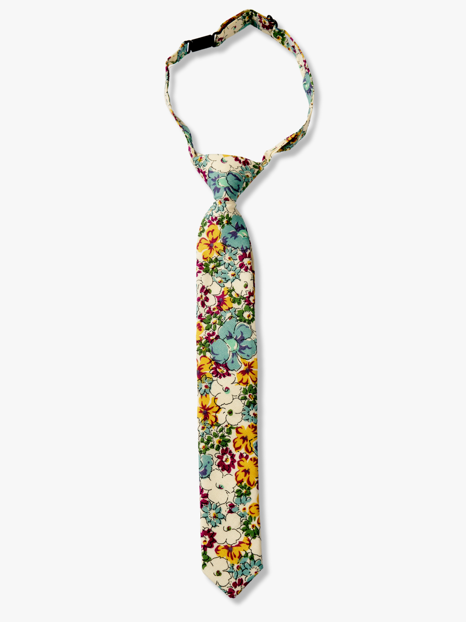 Spring Kids floral pretied tie with pale blue flowers, yellow and burnt orange petals, white blossoms and small green flowers