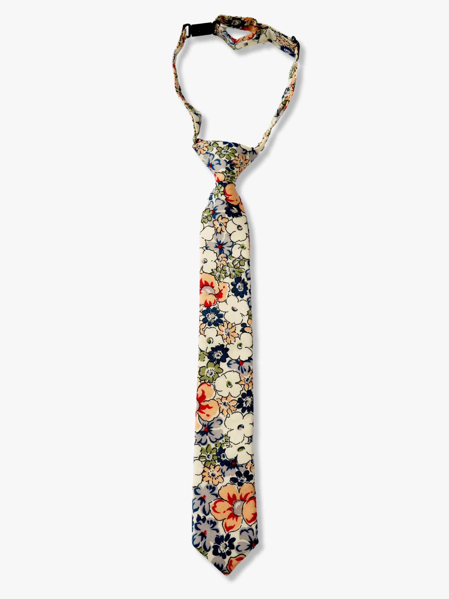 Kids floral pretied tie with blue flowers, white petals, and peach or salmon blossoms and green leaves on white cotton fabric