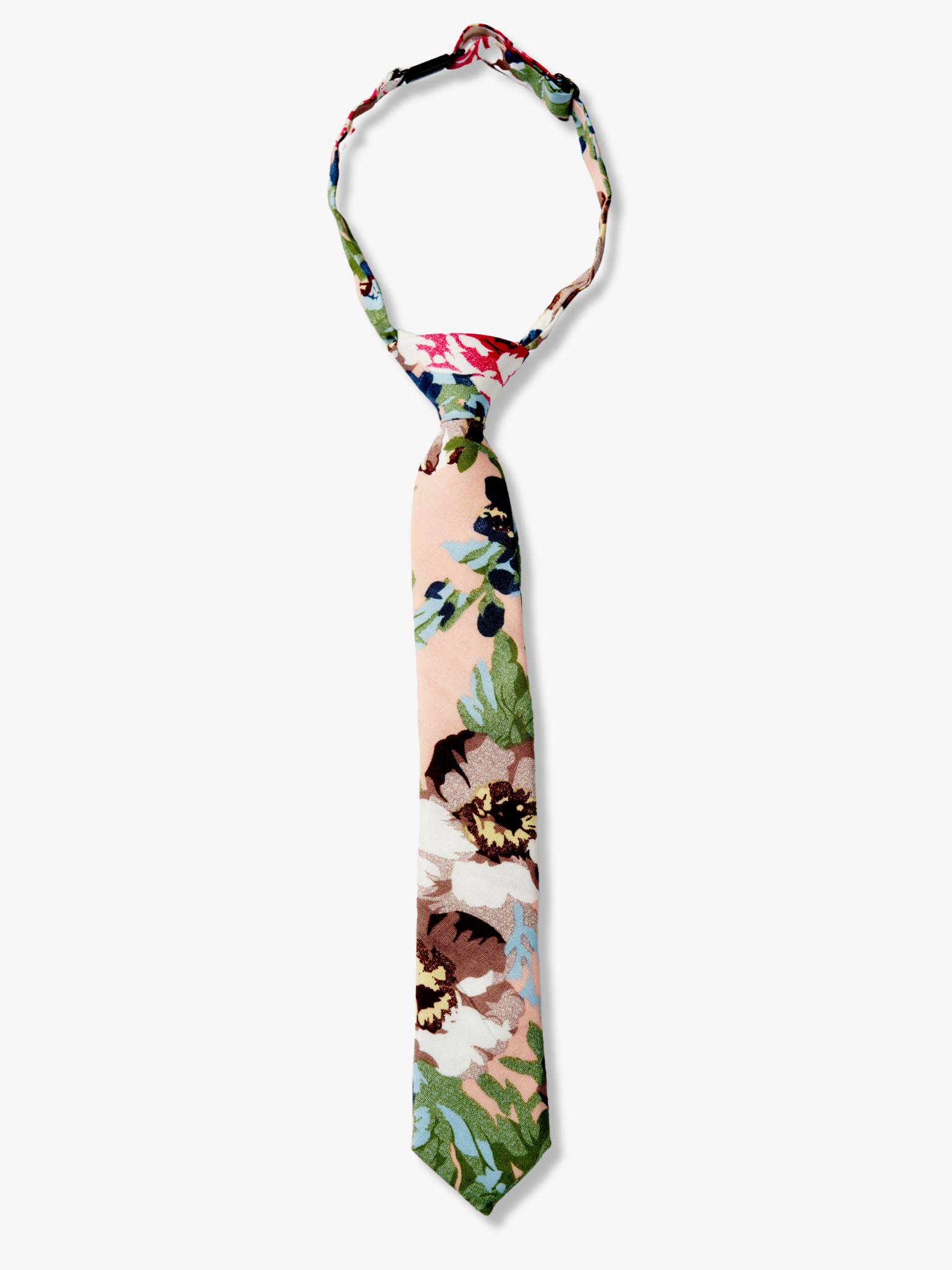 Kids floral pretied tie with dark blue flowers, brown petals, and light green watercolor leaves on light pink cotton fabric.