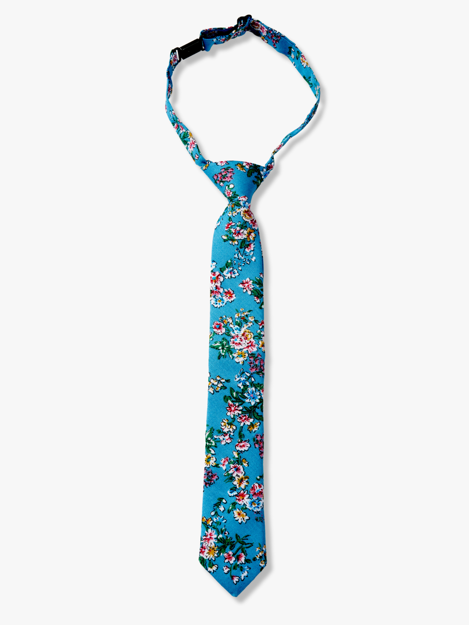 Kids floral pretied tie with watercolor turqouise flowers, pink and yellow blossoms, and green leaves on blue cotton fabric.