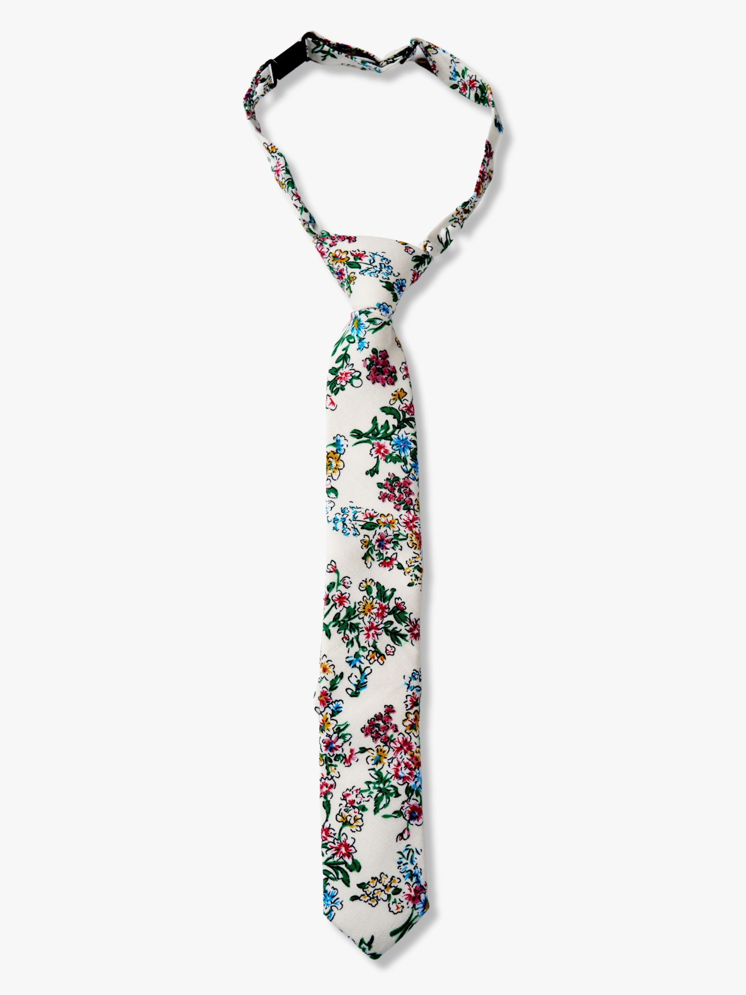 Kids floral pretied tie with watercolor turquoise flowers, pink and yellow blossoms, and green leaves on white cotton fabric.