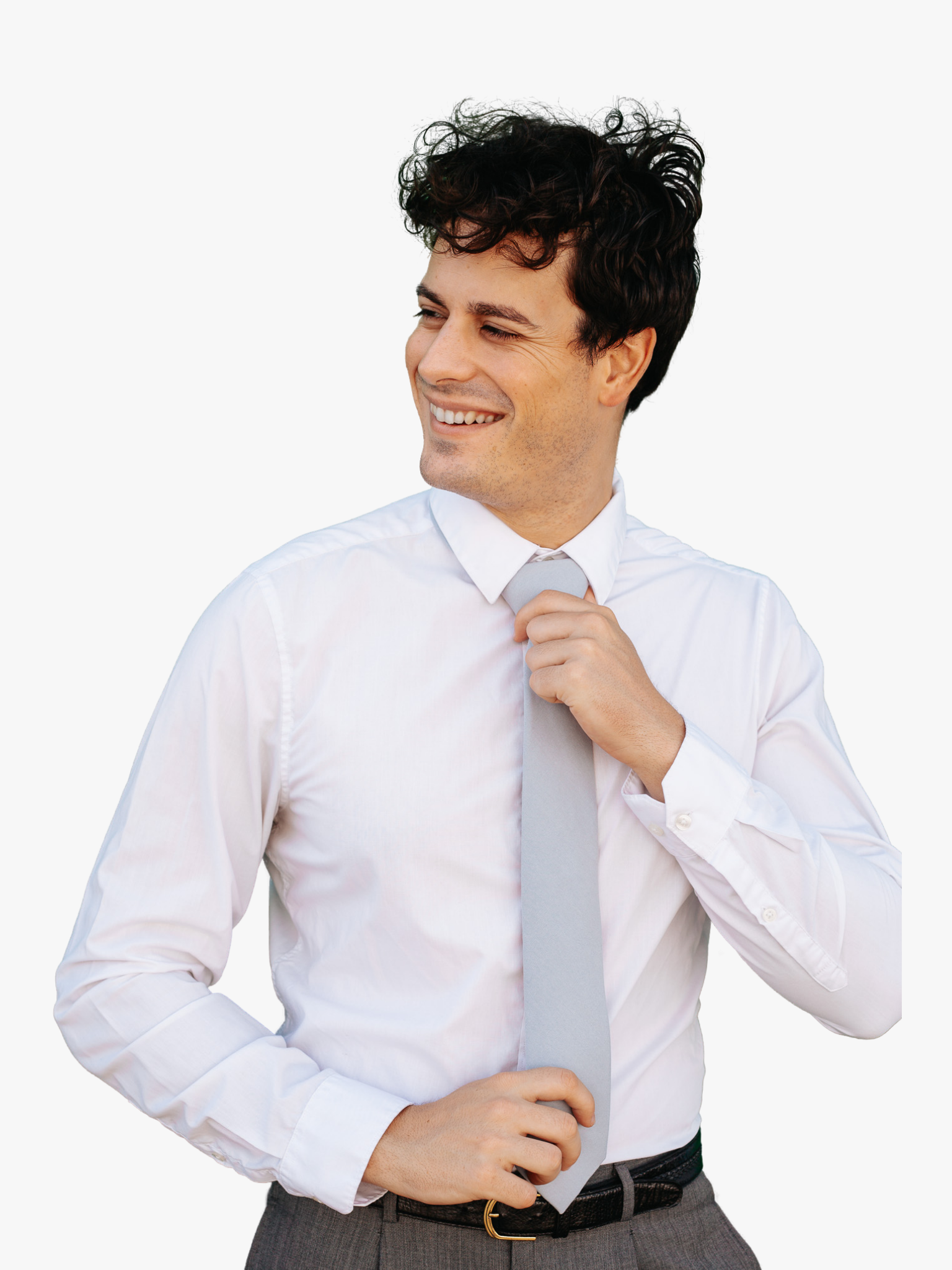 A man with a solid tie with a plain pale solid blue/gray color.