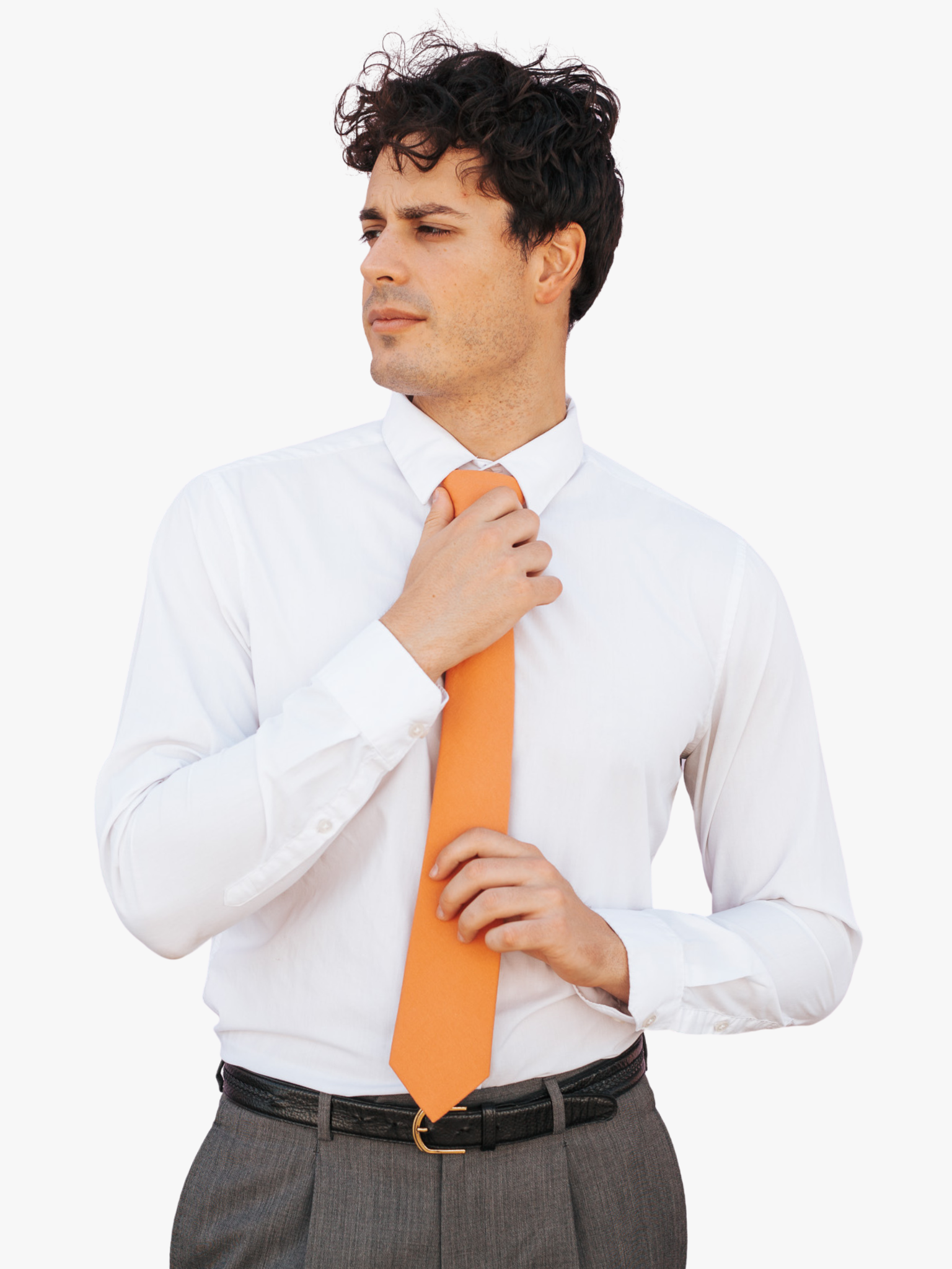 A man with a solid tie with a plain burnt orange salmon color.