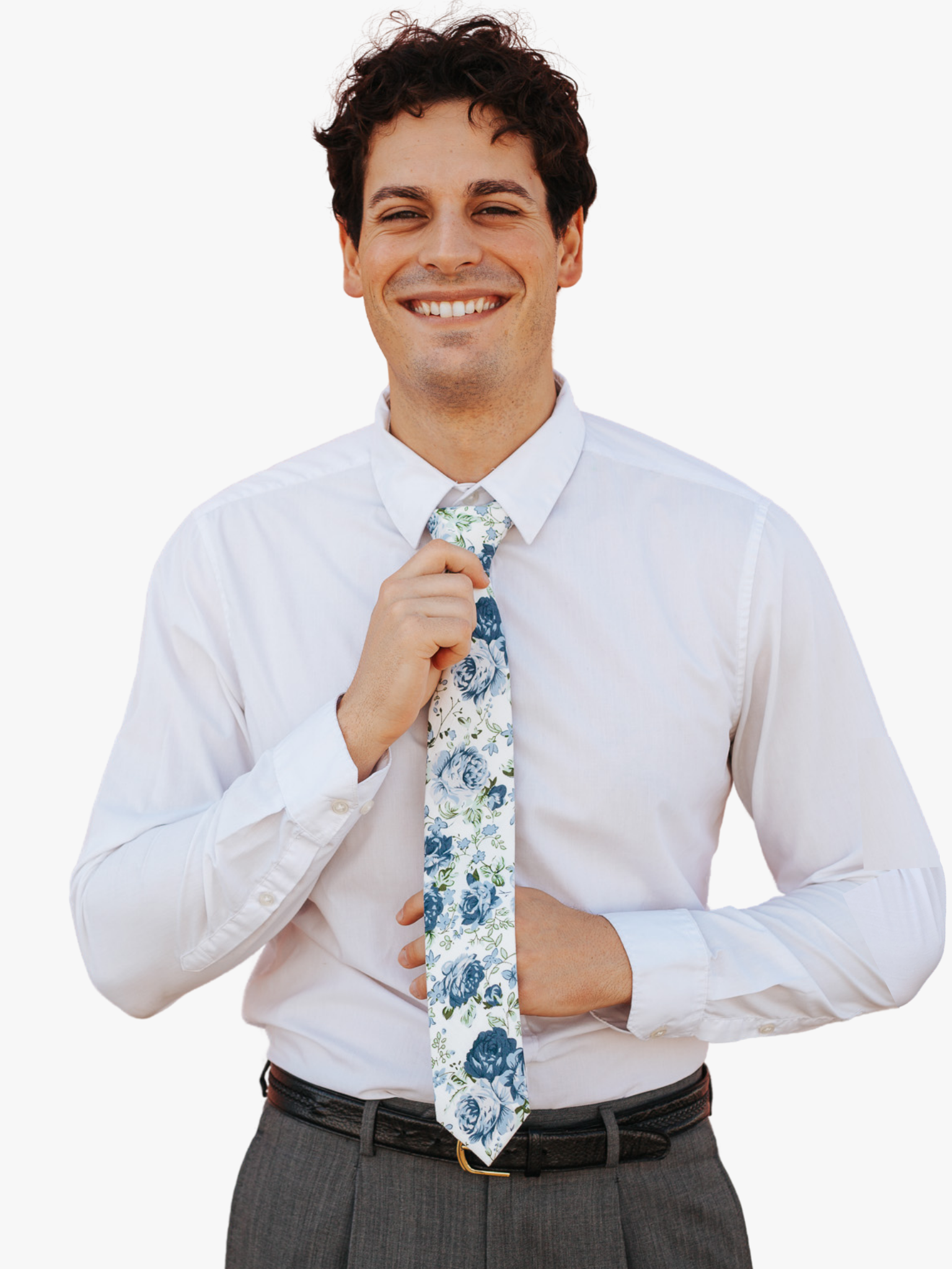 A man wearing a floral tie with  large blue flowers, dusty petals, and light green leaves.