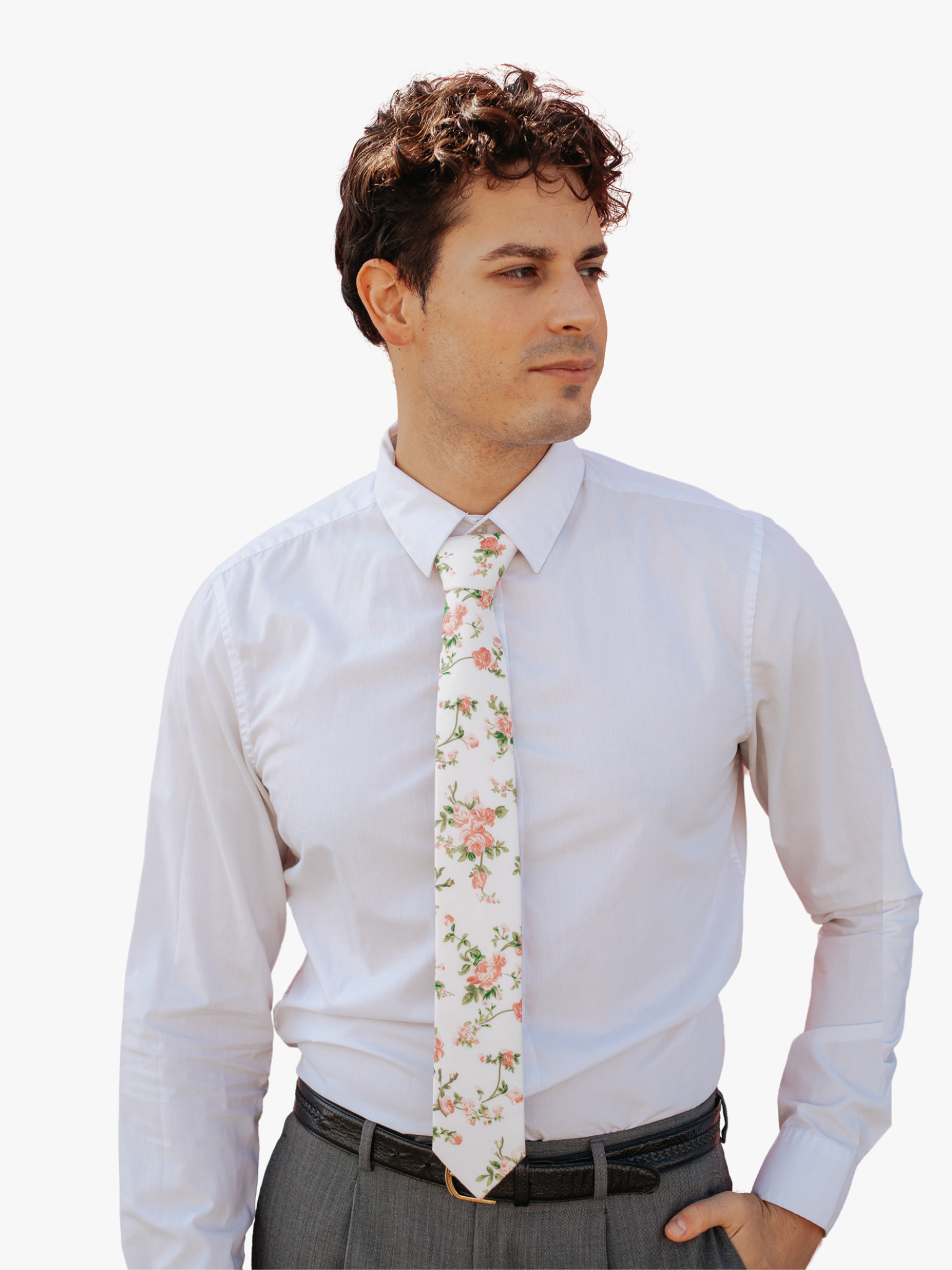 A man in dress clothes wearing a floral tie with  light pink pastel flowers, pale stems, and light green leaves.