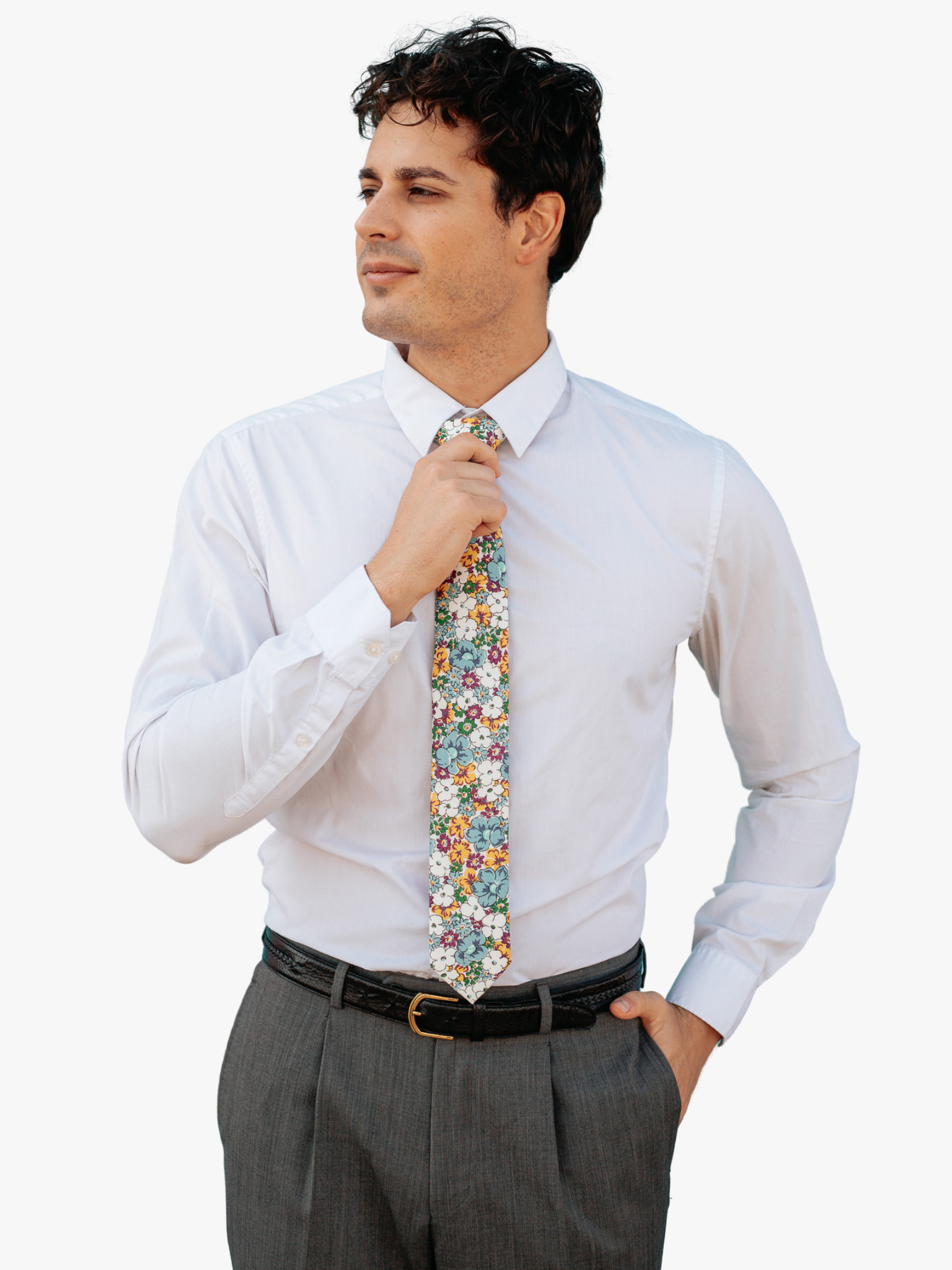 A man wearing a floral tie with pale blue flowers, yellow and burnt orange petals, white blossoms and small green flowers.