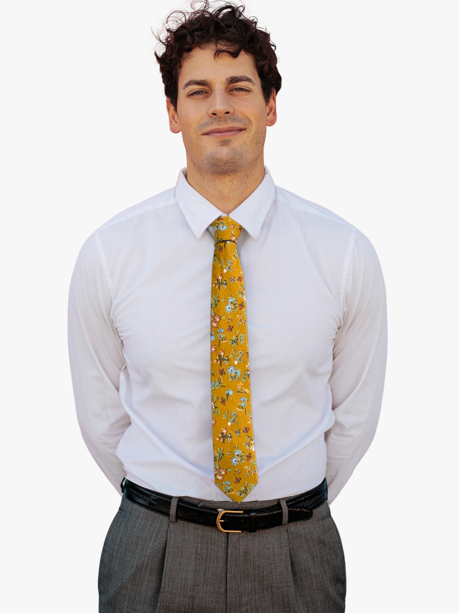 A man wearing a floral tie with mustard yellow fabric, dusty blue flowers, sage green leaves, and red and white accents.