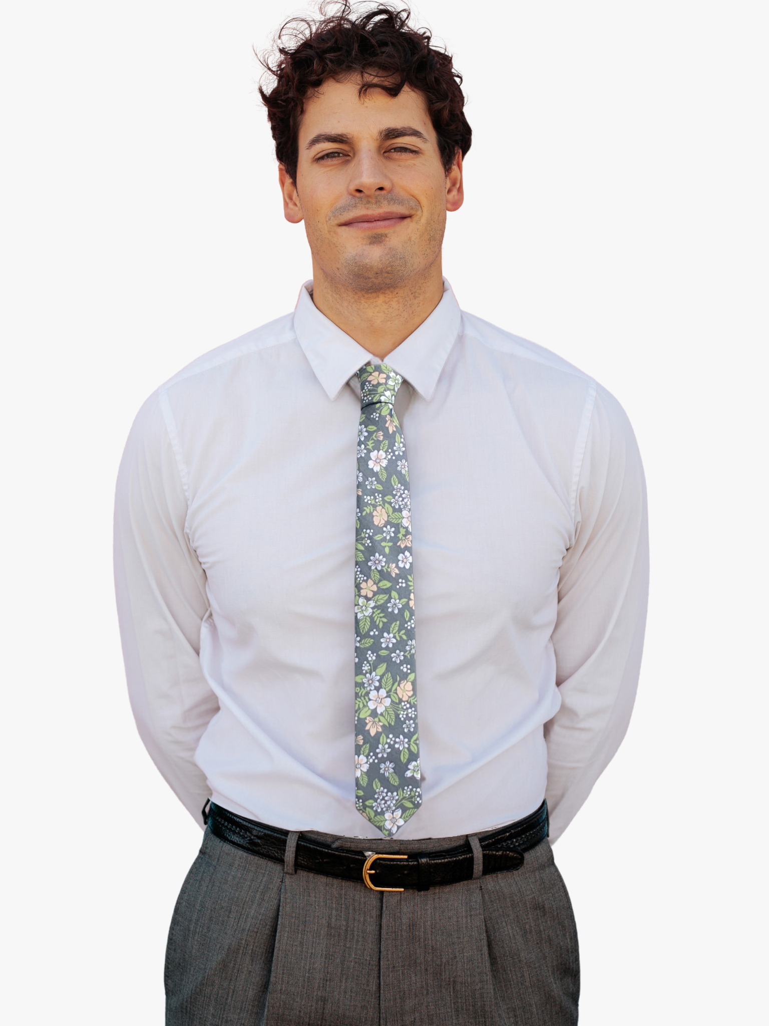 A man wearing a floral tie with gray fabric, vibrant cartoon flowers of white, pink petals, and light green leaves.