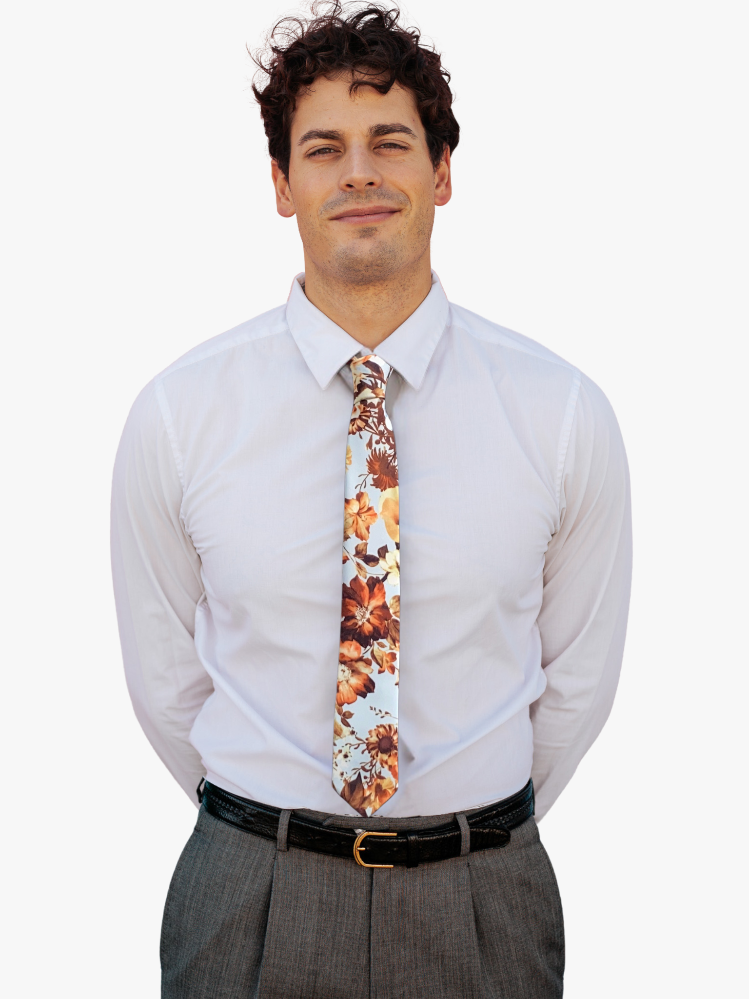 A man wearing a floral tie with autumn-inspired burnt orange colors, bronze and brown flowers, and dried leaves and stems.