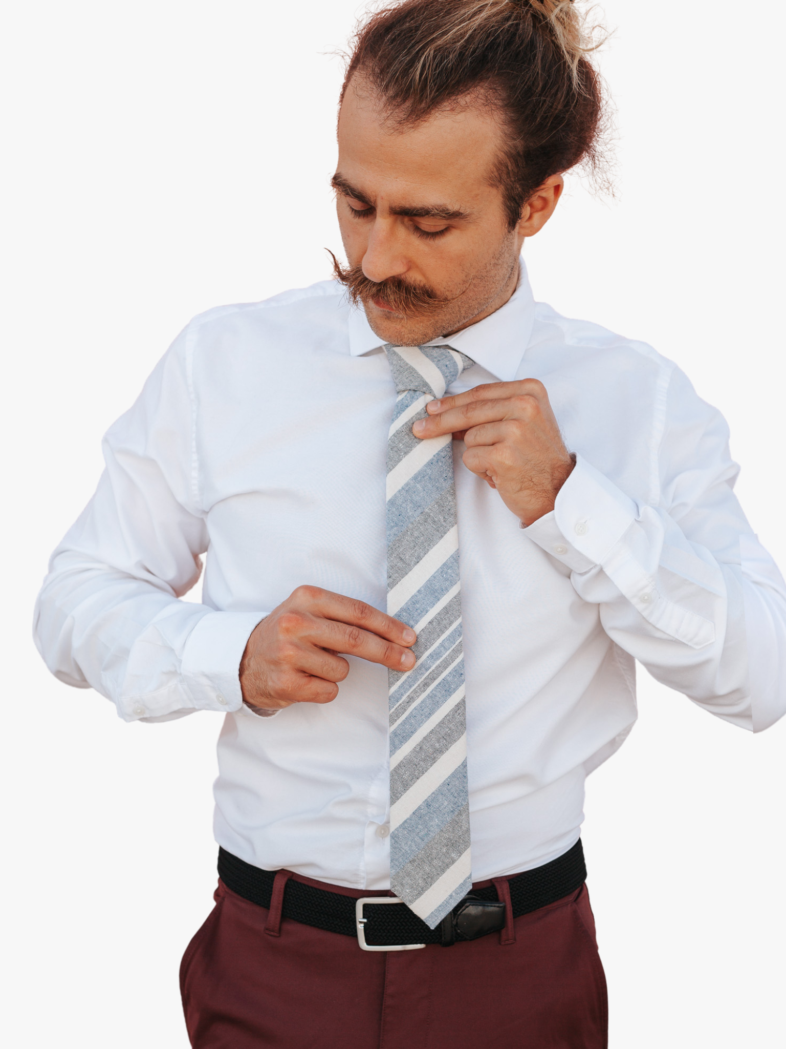 A man wearing a striped tie with denim blue stripe, beige cream lines, gray/grey bars and diagonal designs.