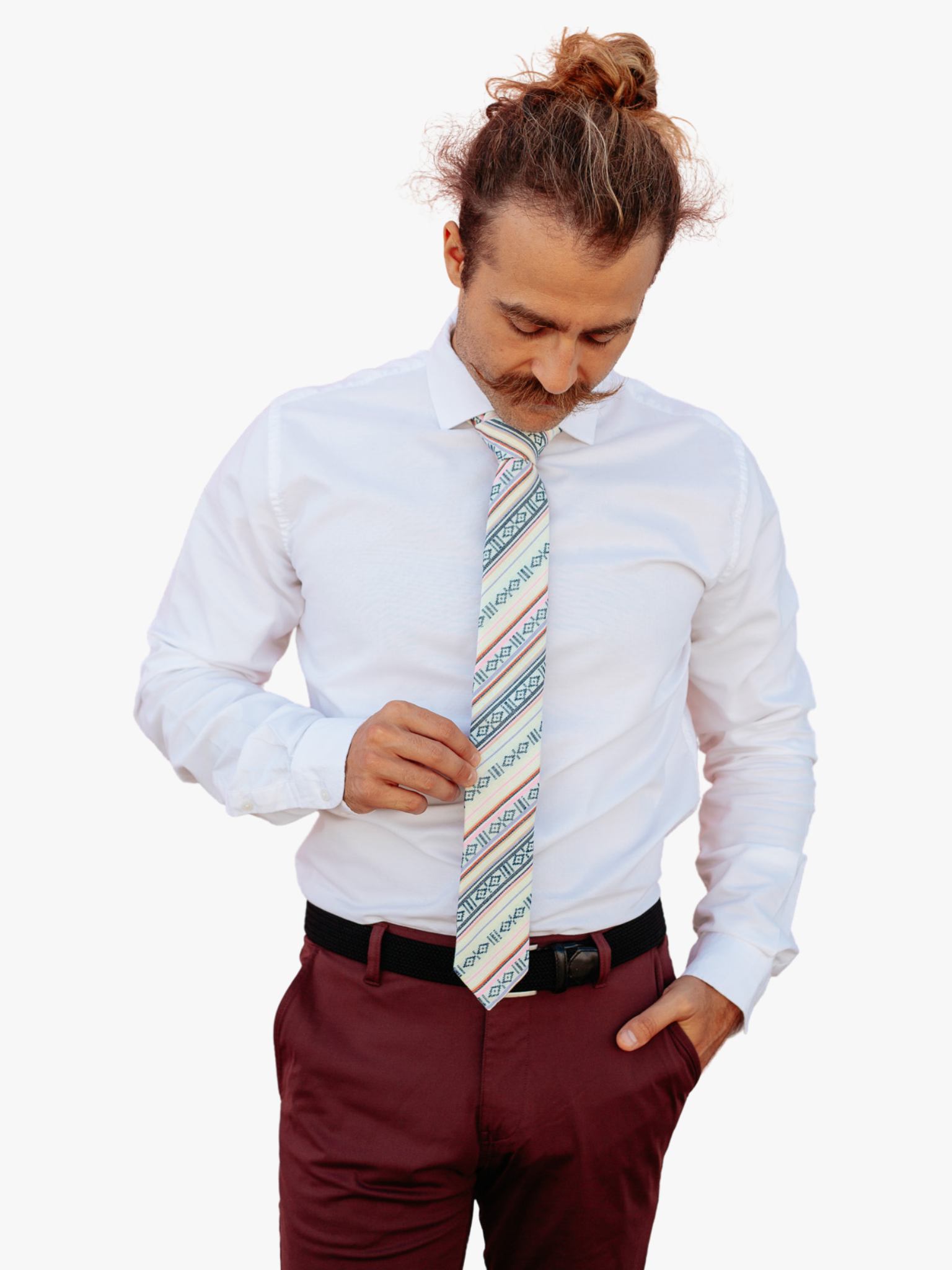 A man wearing a striped tie with black stripes, pink lines, red bars and diagonal designs, Native American inspired designs.