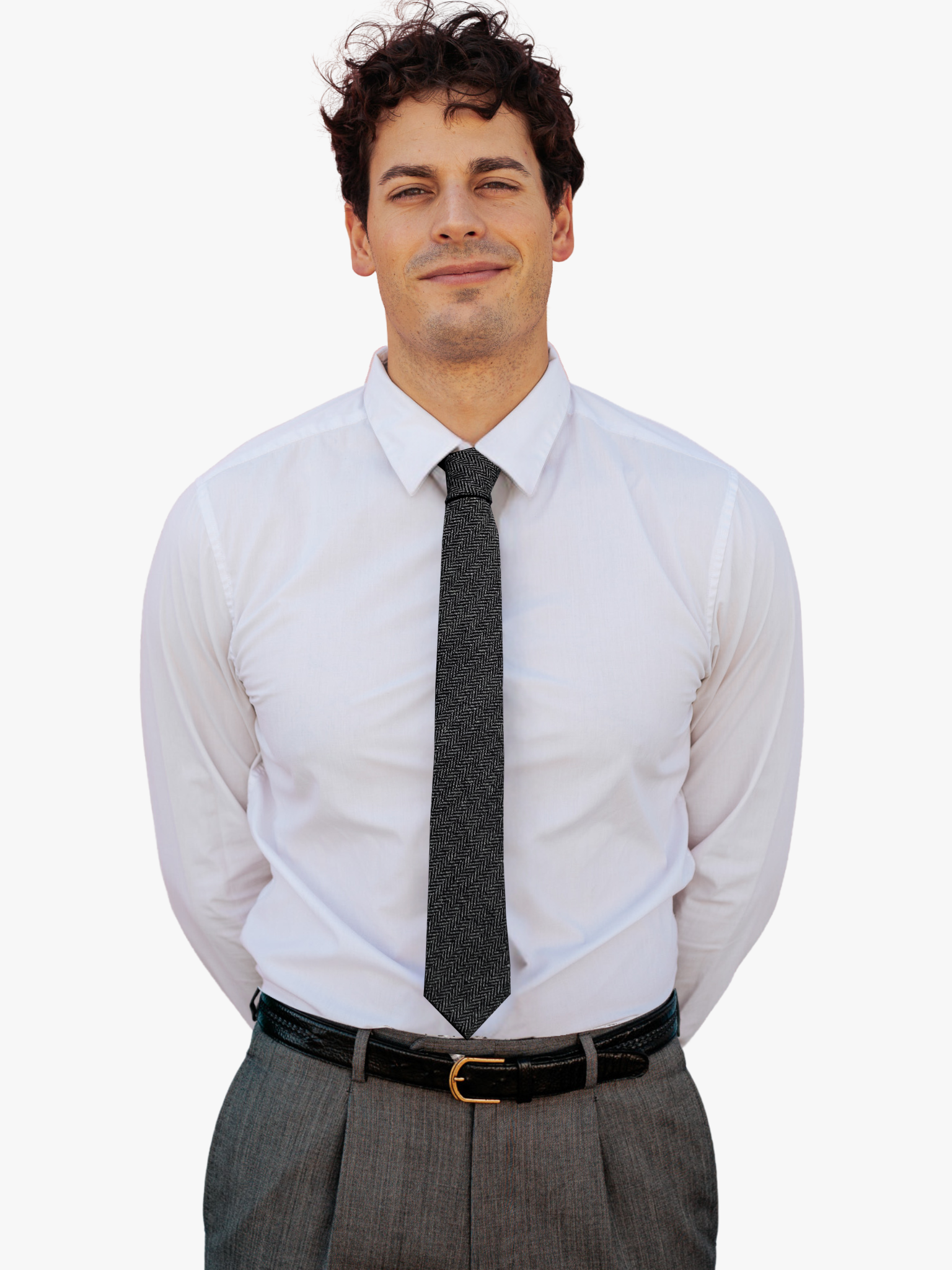 A man wearing a herringbone tie with alternating gray and black zigzag designs on a soft cotton fabric.